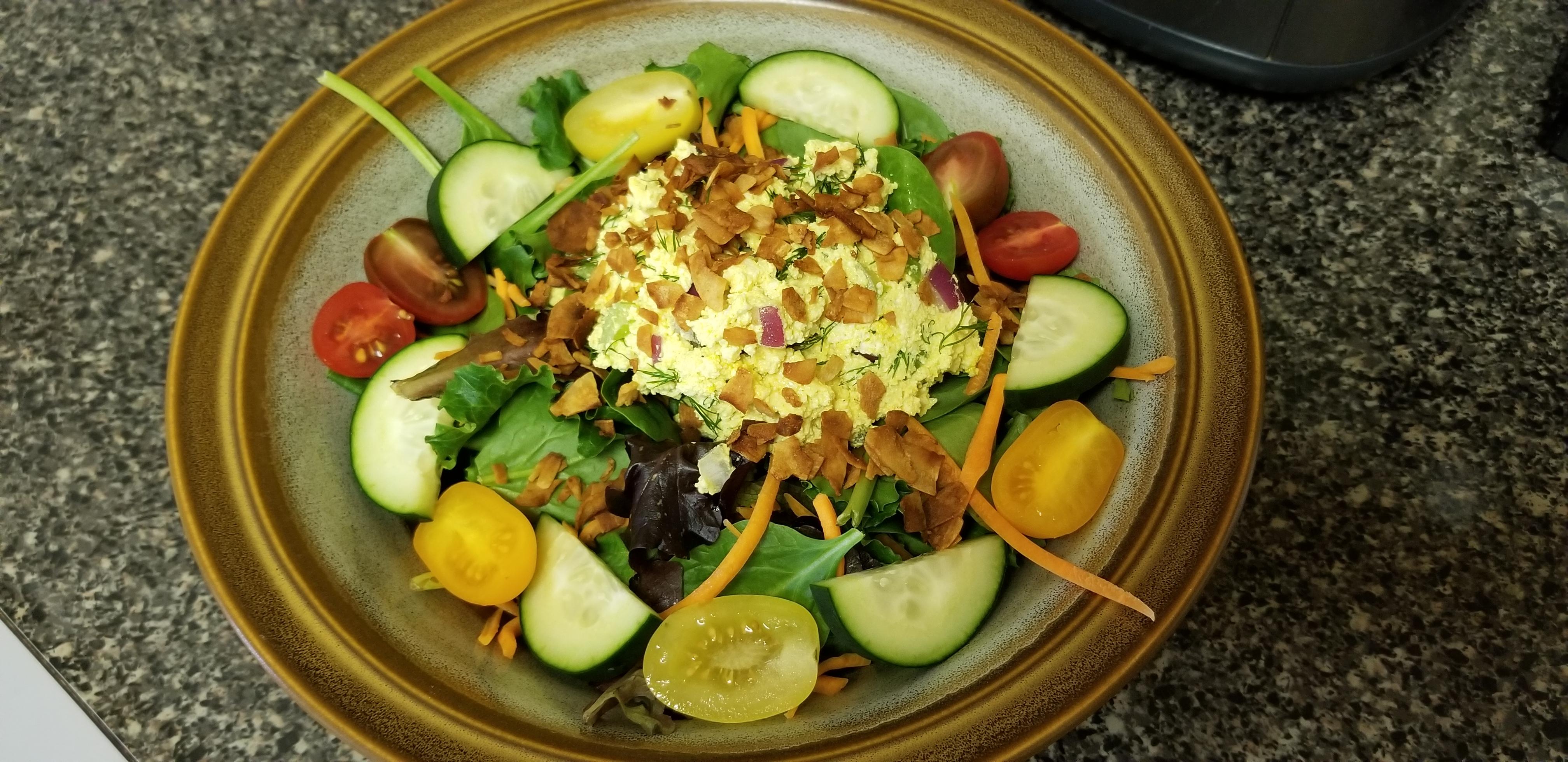 Salad with a scoop of tofu 'egg' salad and coconut 'bacon' bits 277