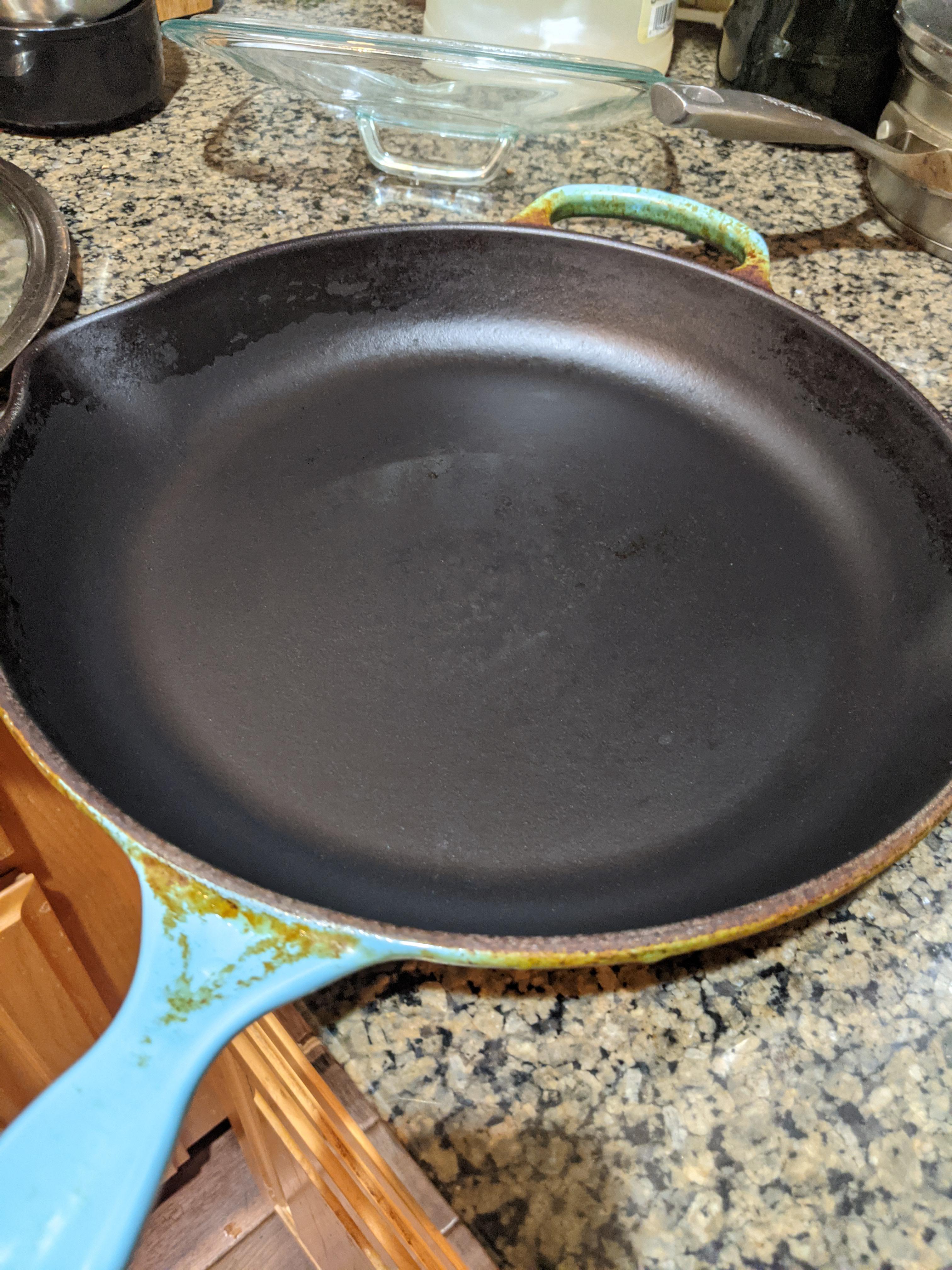 How to remove black spots from Le Creuset enameled skillet? Already