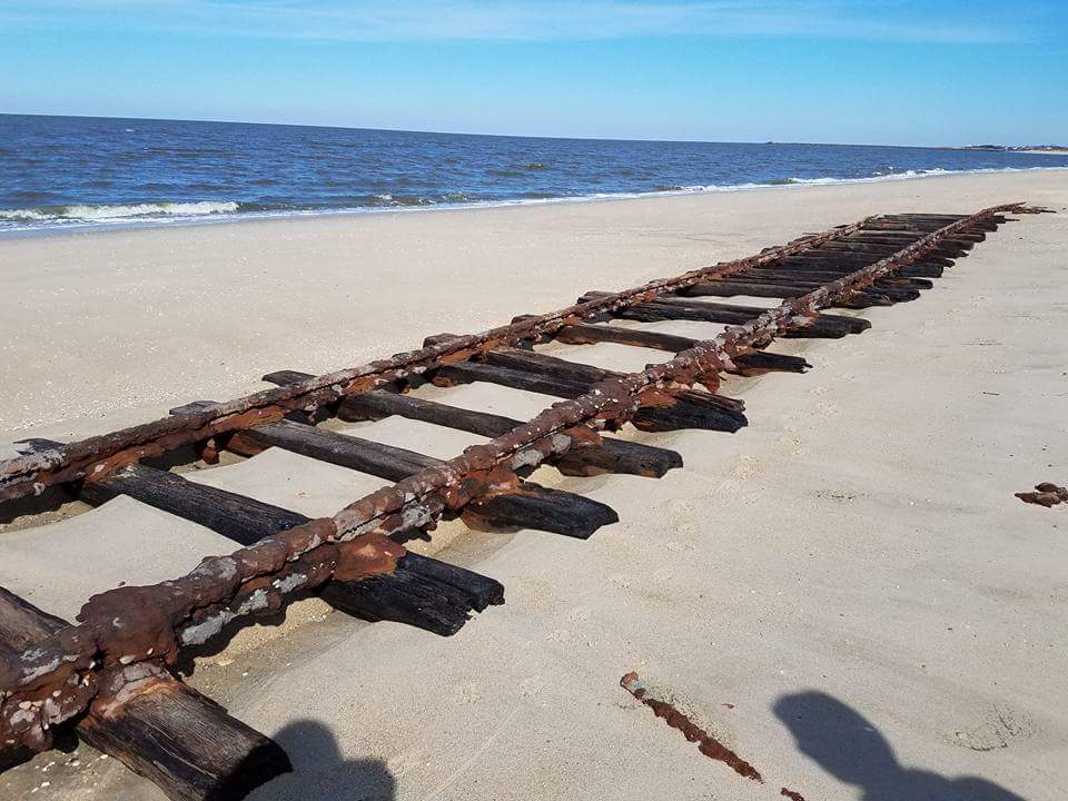 Railroad tracks on the beach at Cape May Point are exposed after the last 2 storms washed away