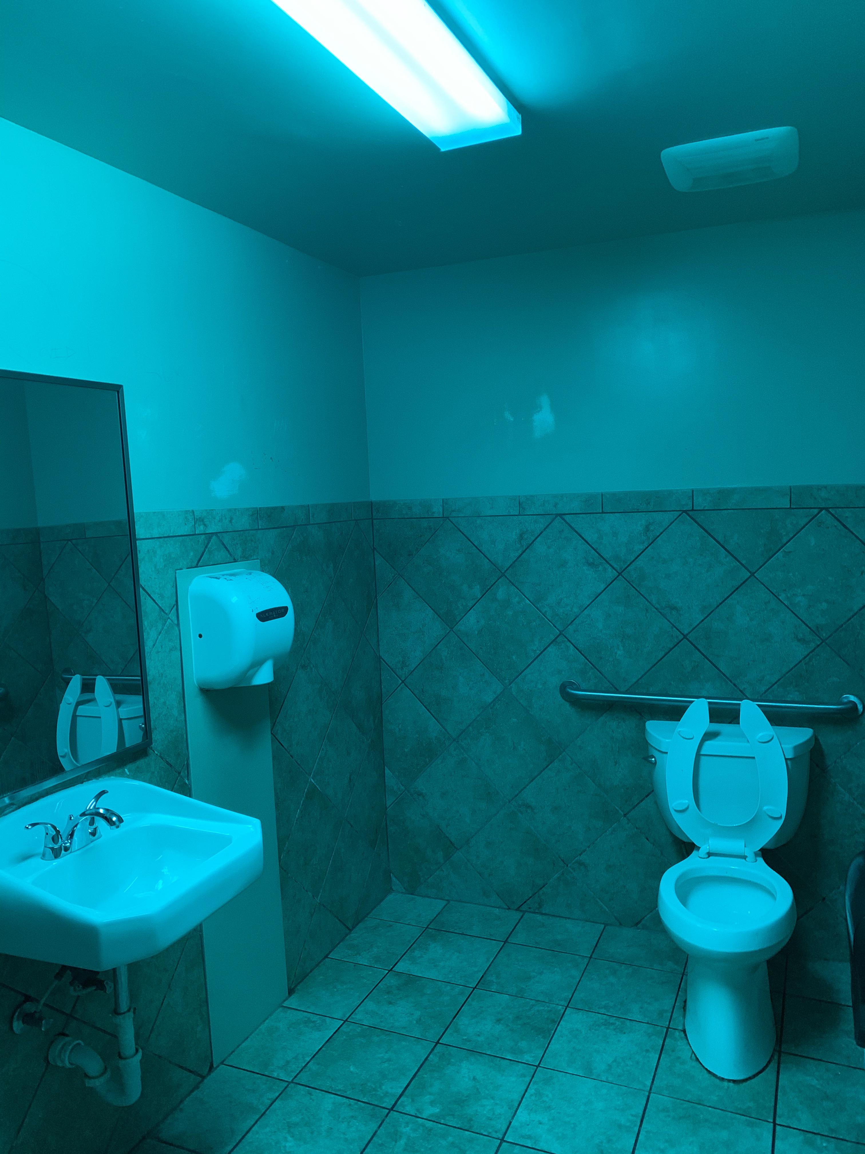 This gas station bathroom is very, very blue. However, it’s not without