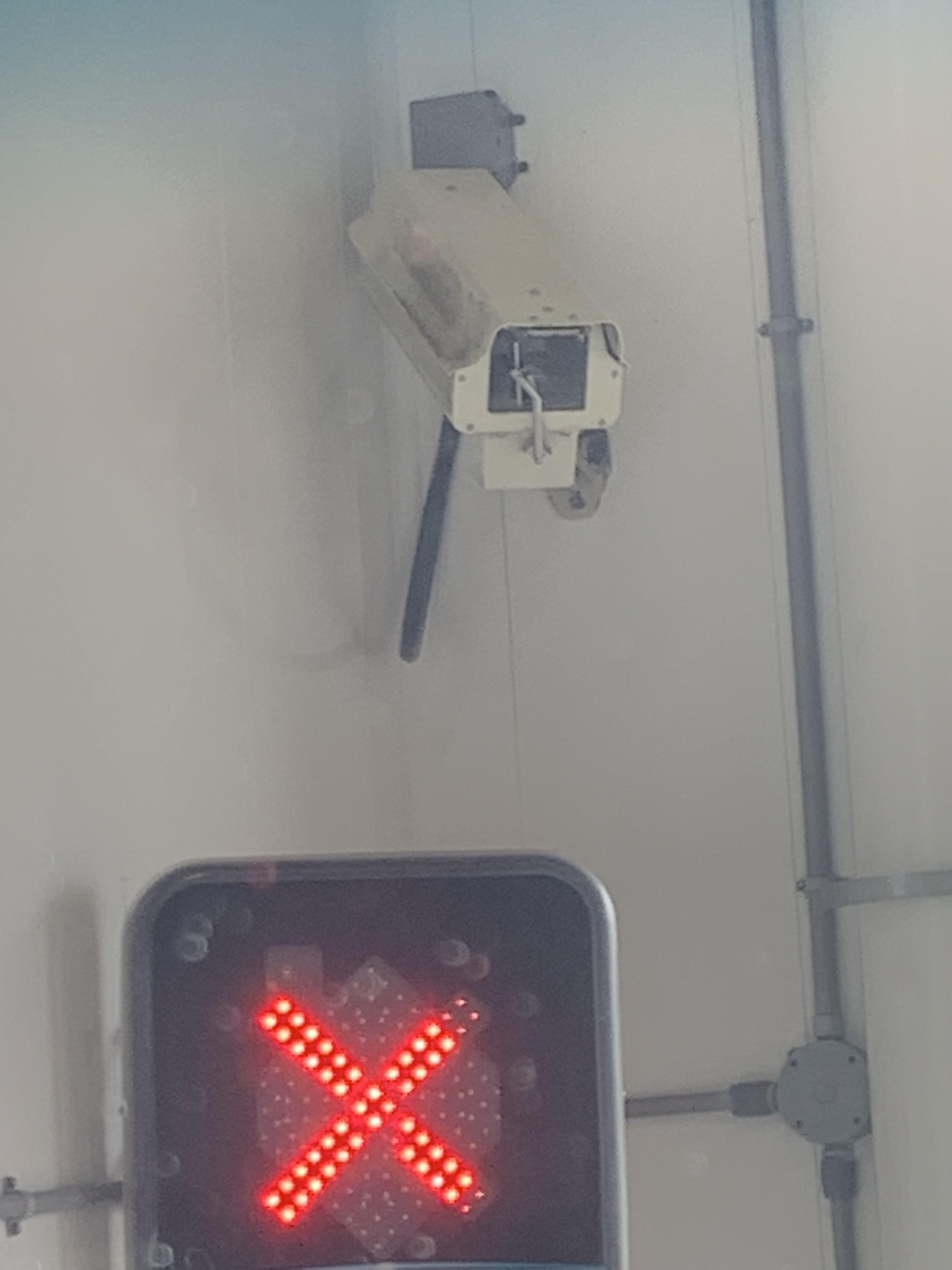 The security camera in the car wash has a little windshield wiper r