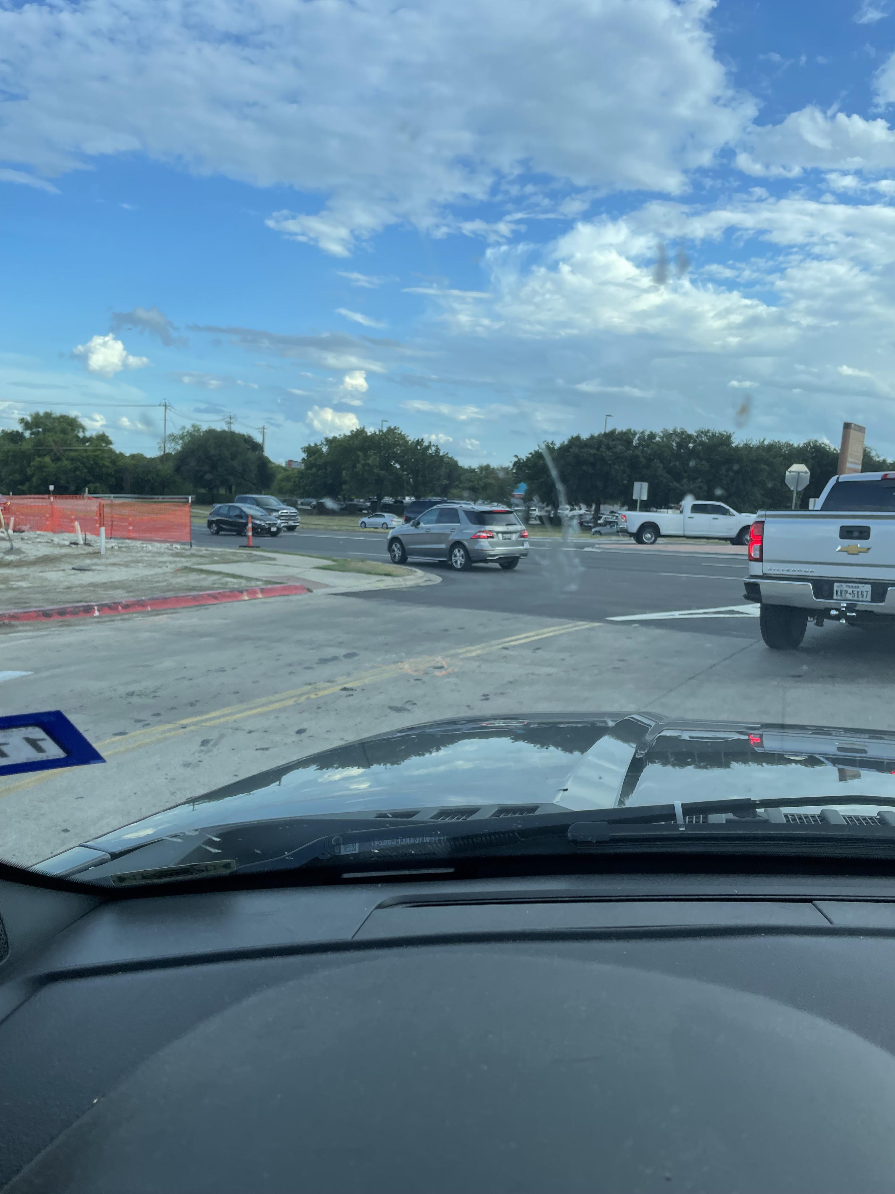 This guy waiting to turn right into an entrance he simply can’t make