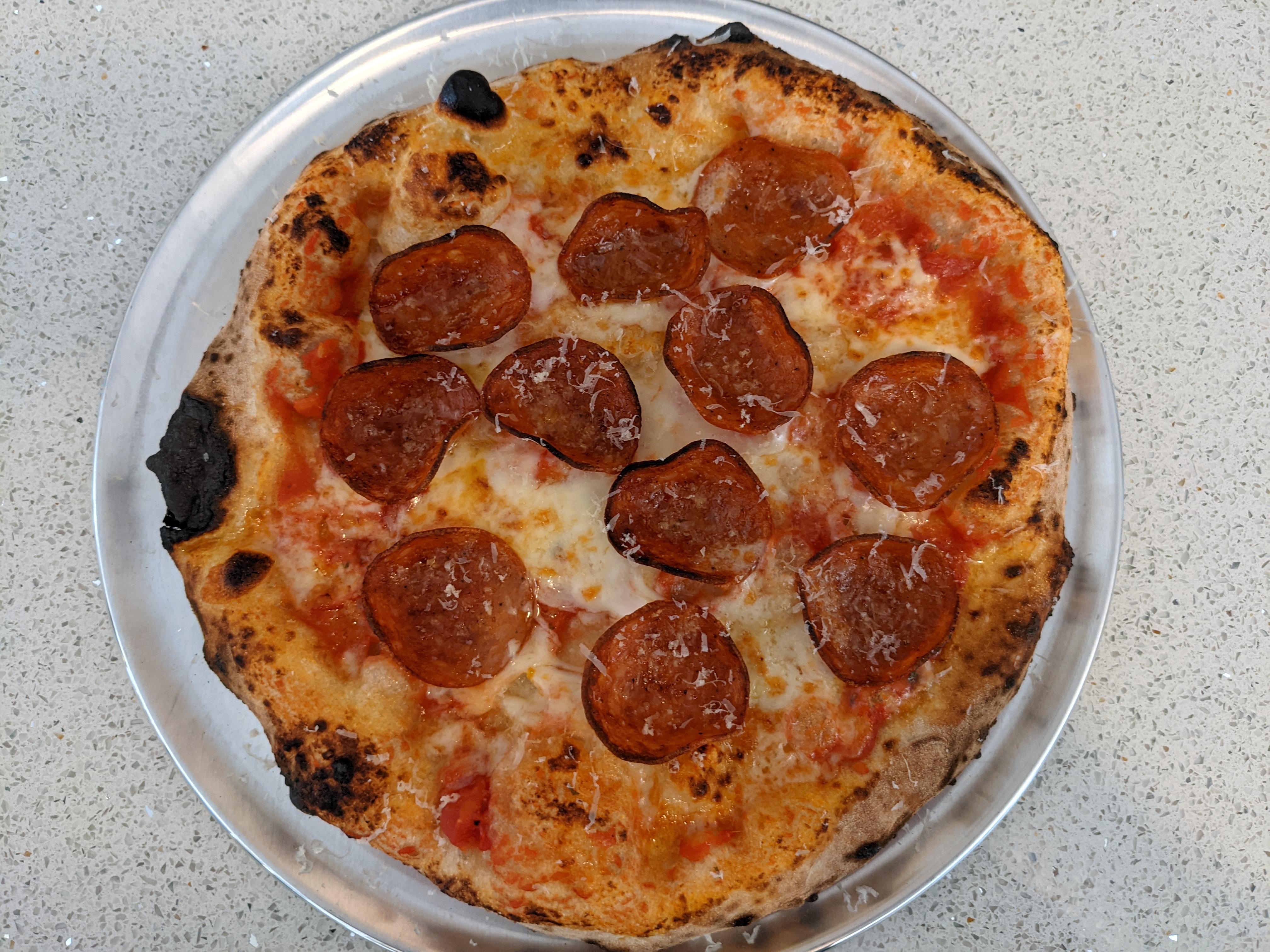 A simple Roni pizza I made in my Roccbox r/Pizza
