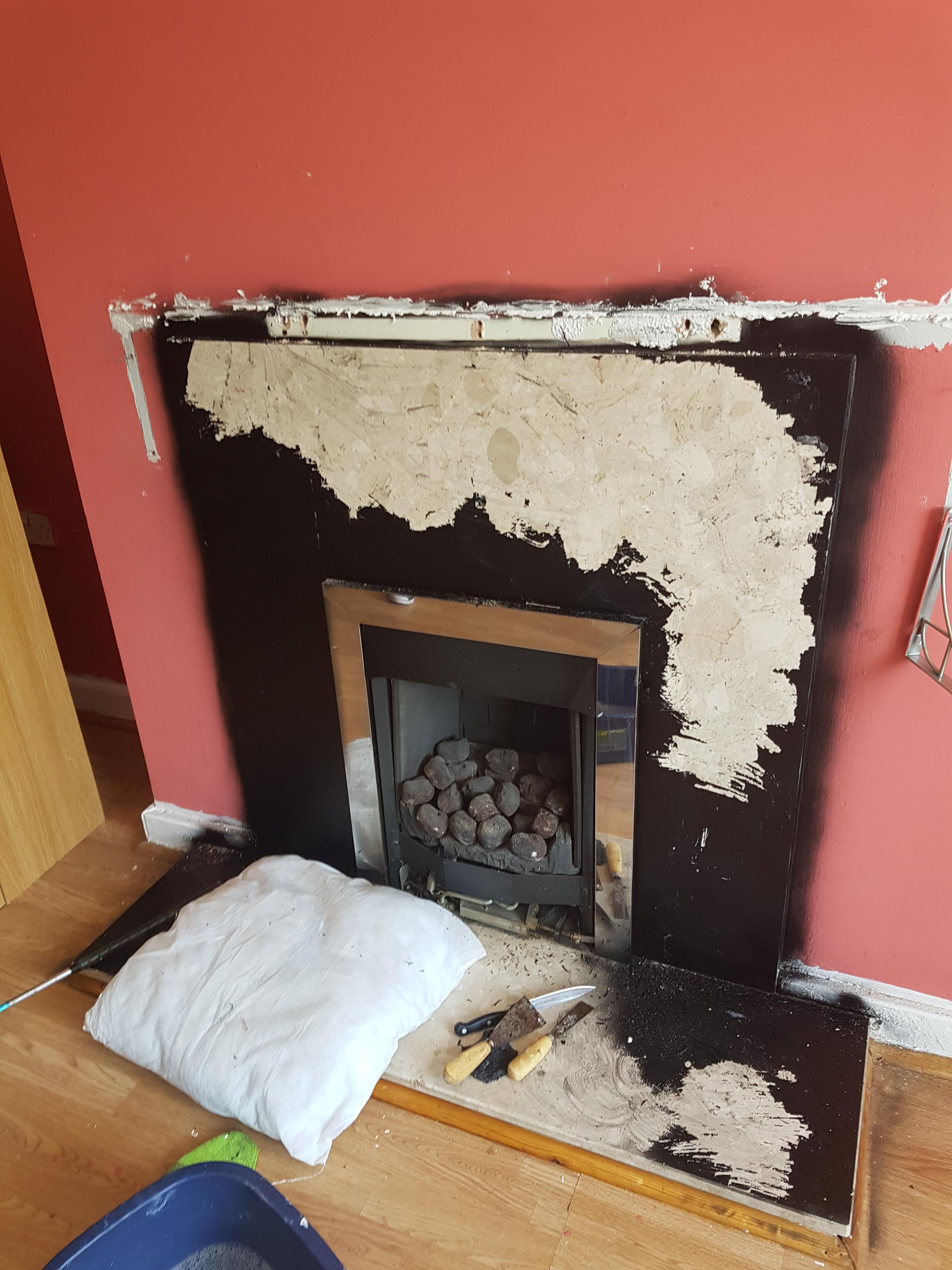 My mother spray painted over the marble fireplace in extremely