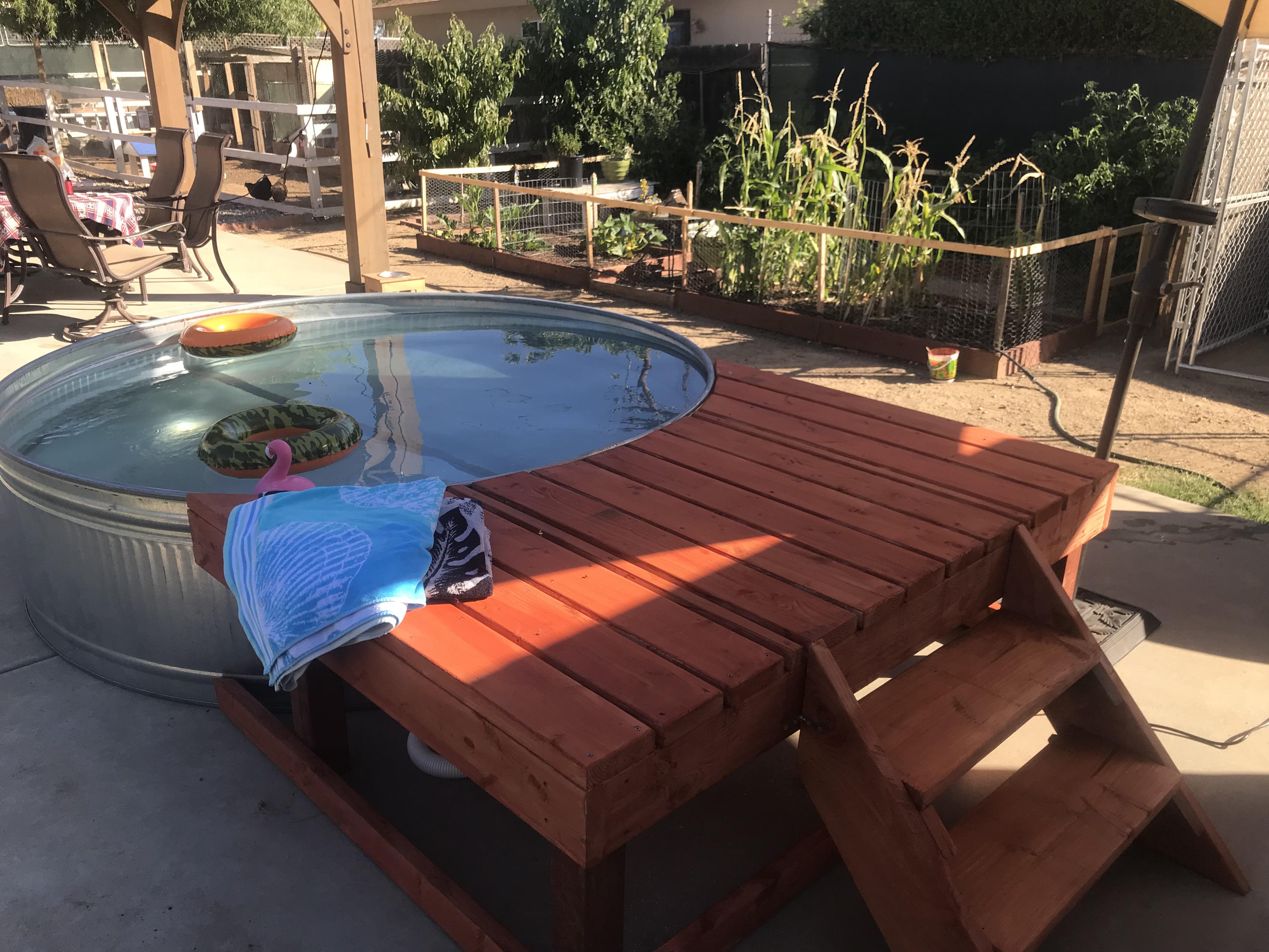 Built us a homestead pool. 8’ round stock tank with a 1500 gpm pump/filter. r/Homesteading