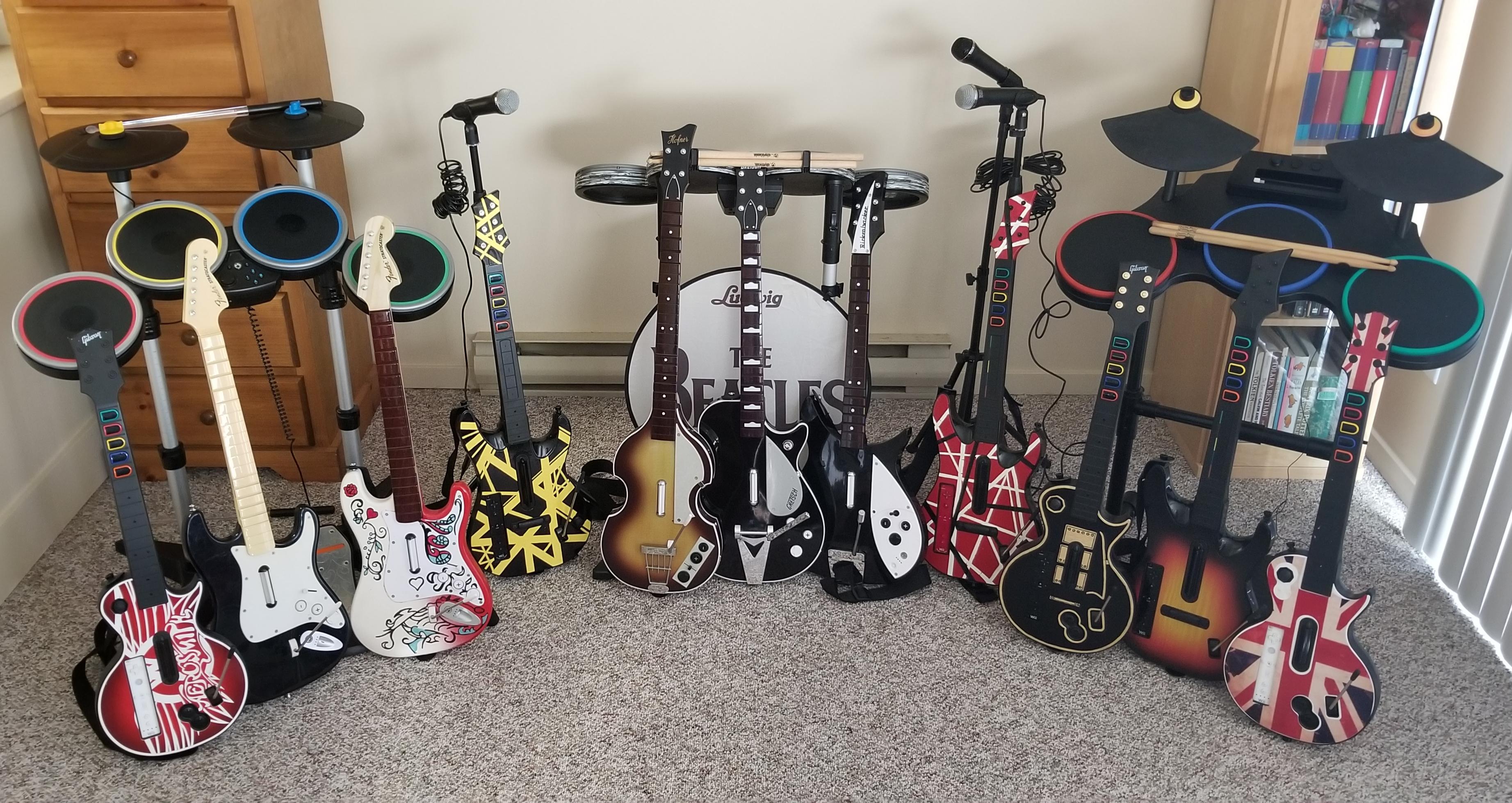 My Rock Band/Guitar Hero collection. Been doing some custom paint jobs