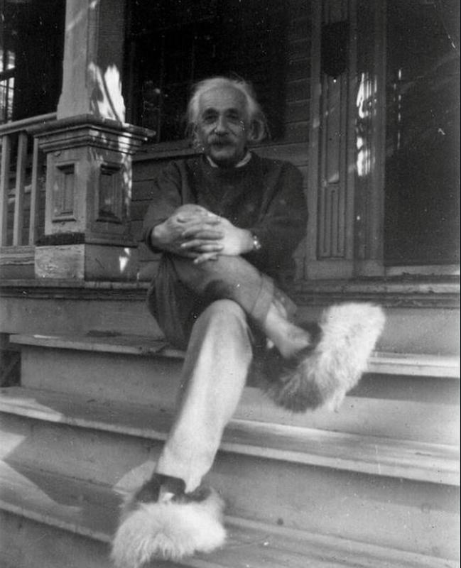 Albert Einstein relaxing on the front steps of his house in Princeton
