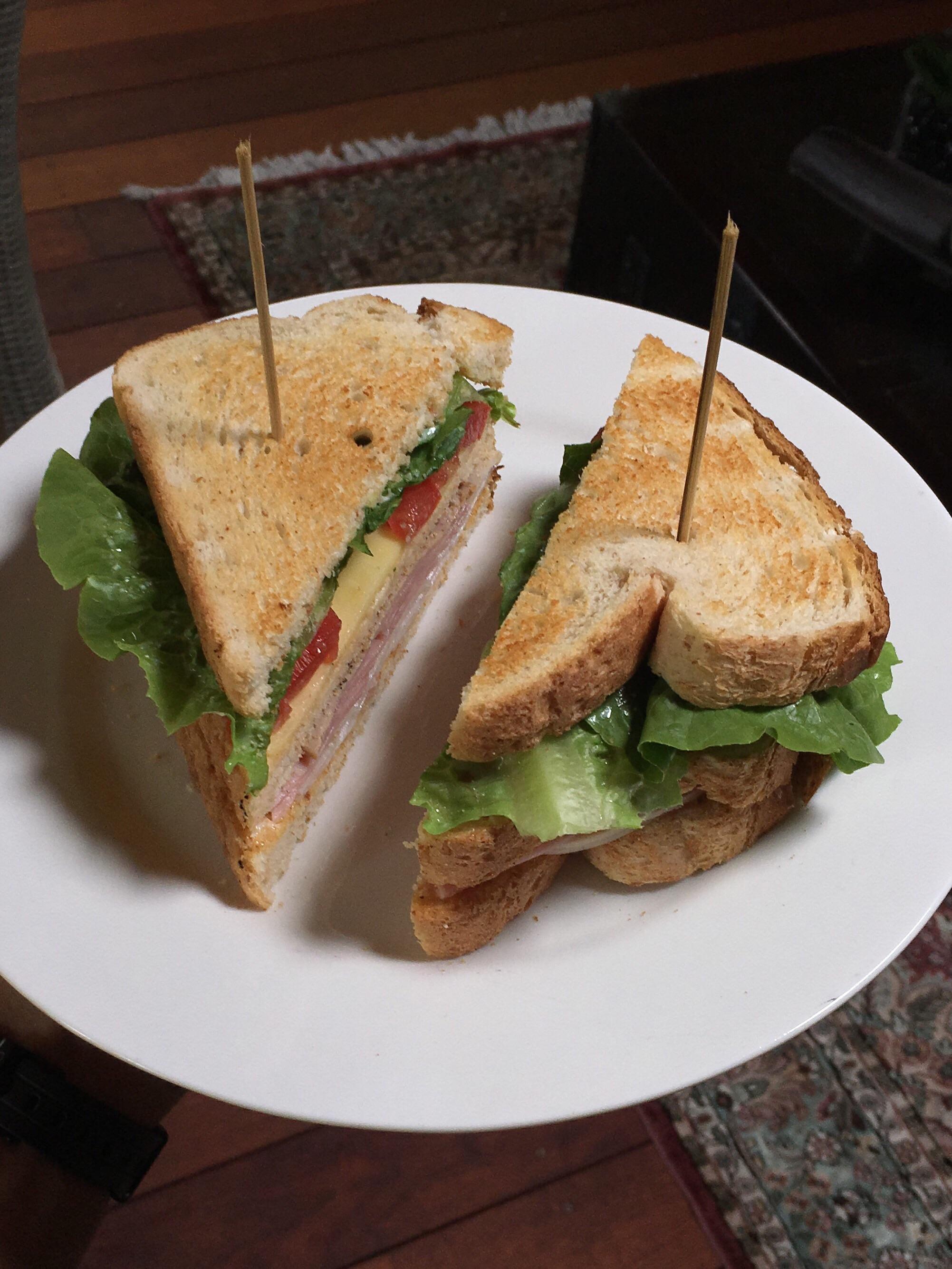 Homemade club w/ turkey, ham, roast beef, cheddar, lettuce, tomato