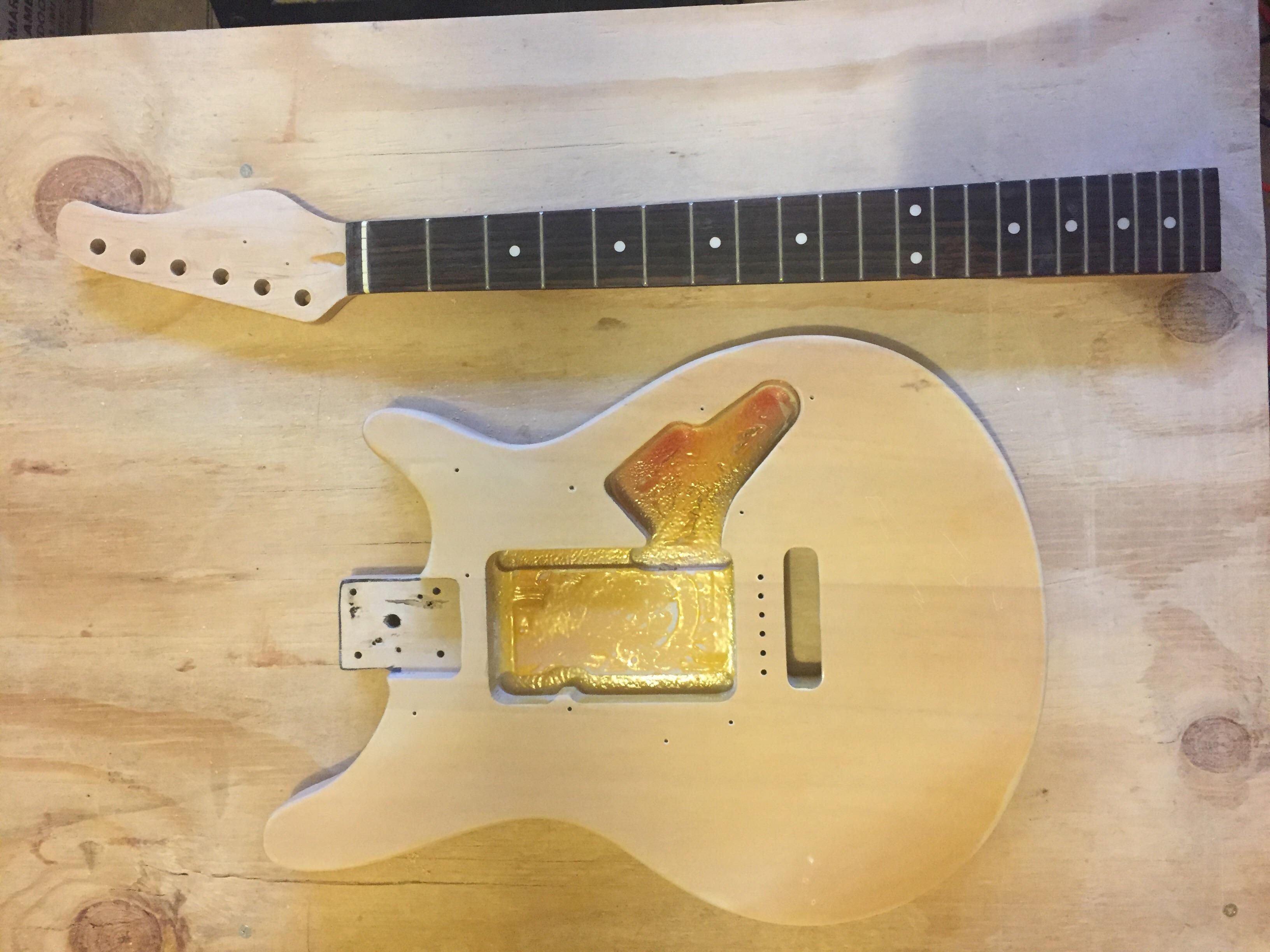 Finished stripping the paint off of this project guitar. I’m looking
