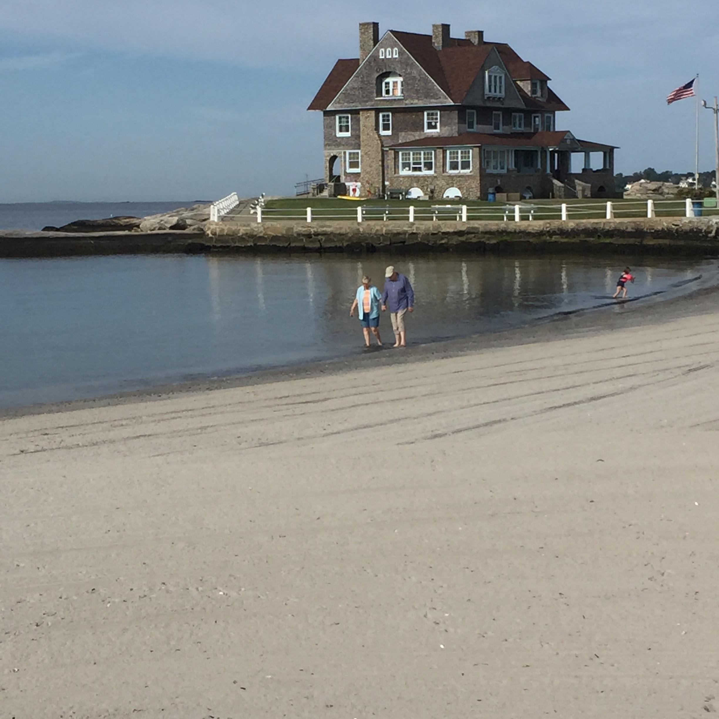 This old couple taking an early morning walk at Eastern Point Beach in