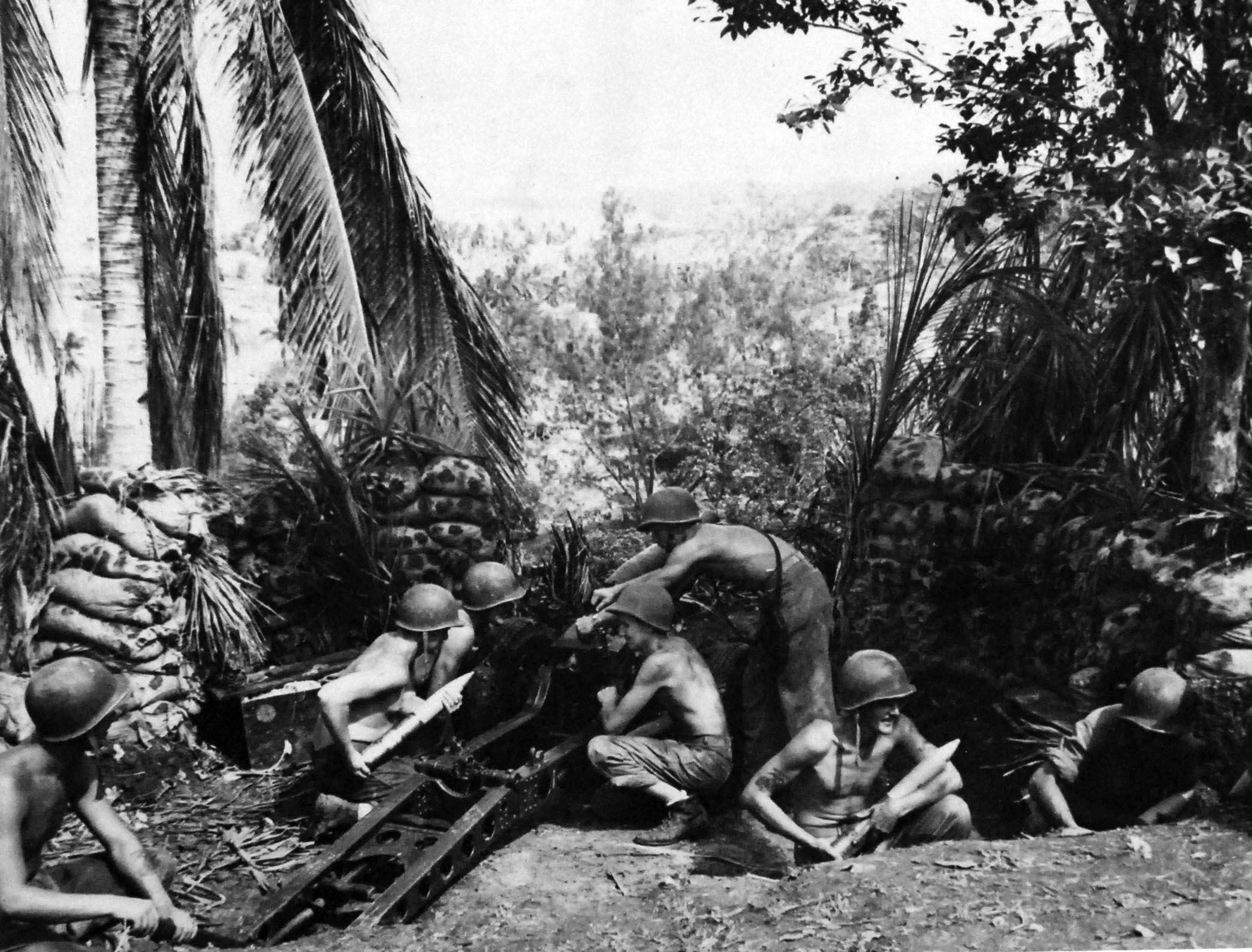 U.S. Marines man field gun emplacements that they captured in the early