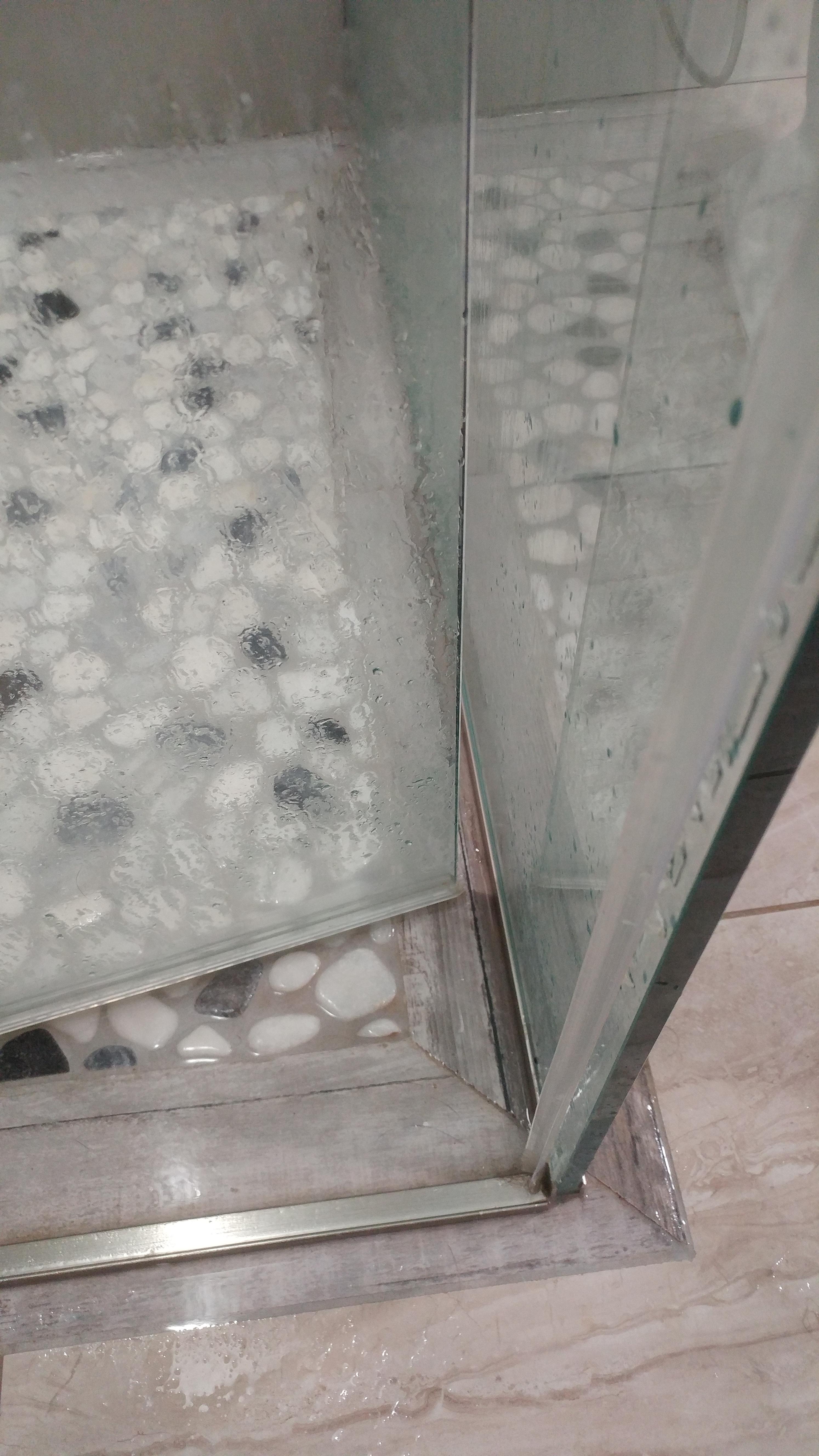 Shower door doesn't close all the way, rubber water stopper strip just