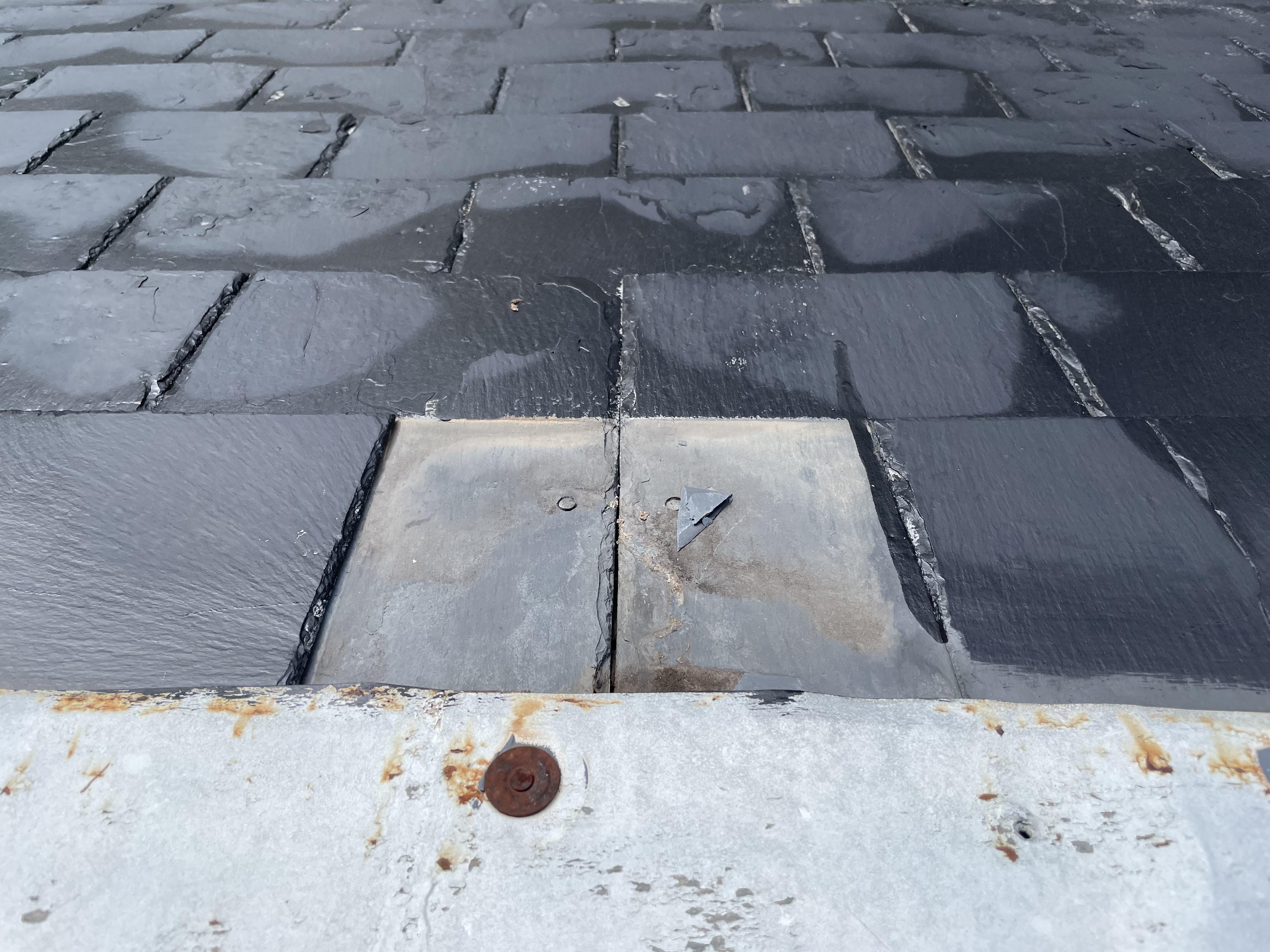 Lost 1 slate shingle. Best way to repair this? Can I use roofing cement