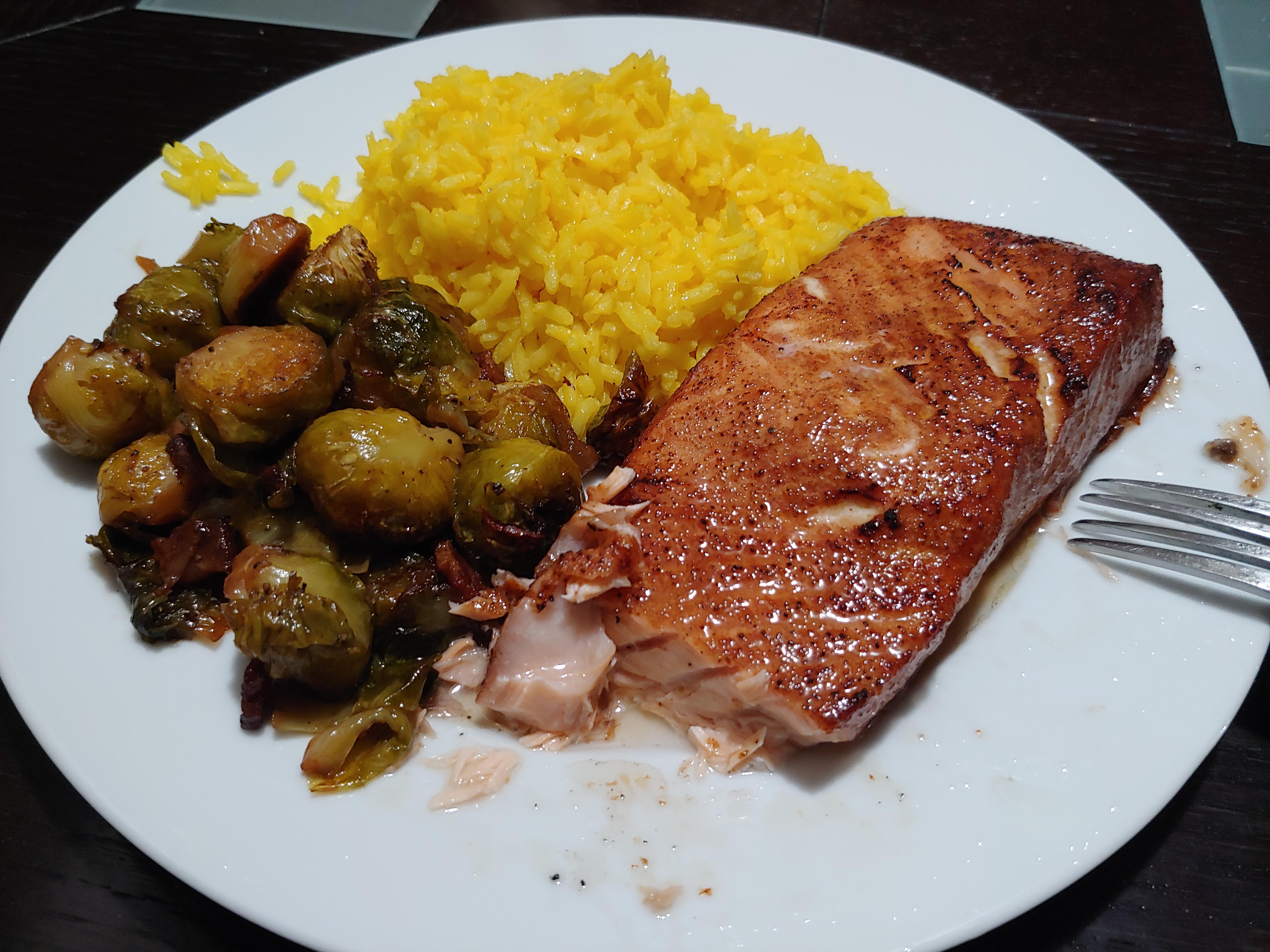 Hickory smoked cedar plank salmon with yellow rice and cajun brussel