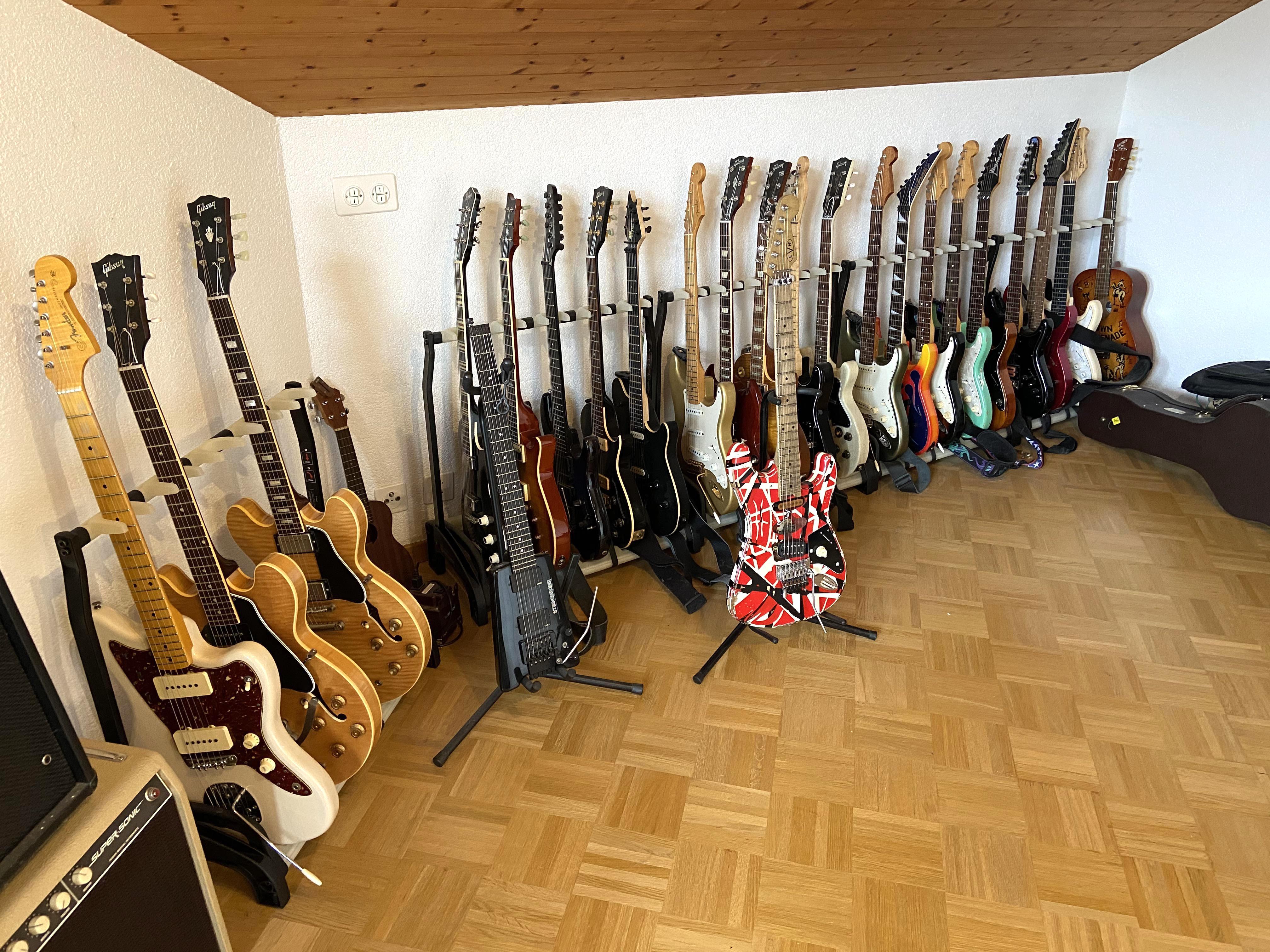 My much too large collection of guitars...well, most of them. r