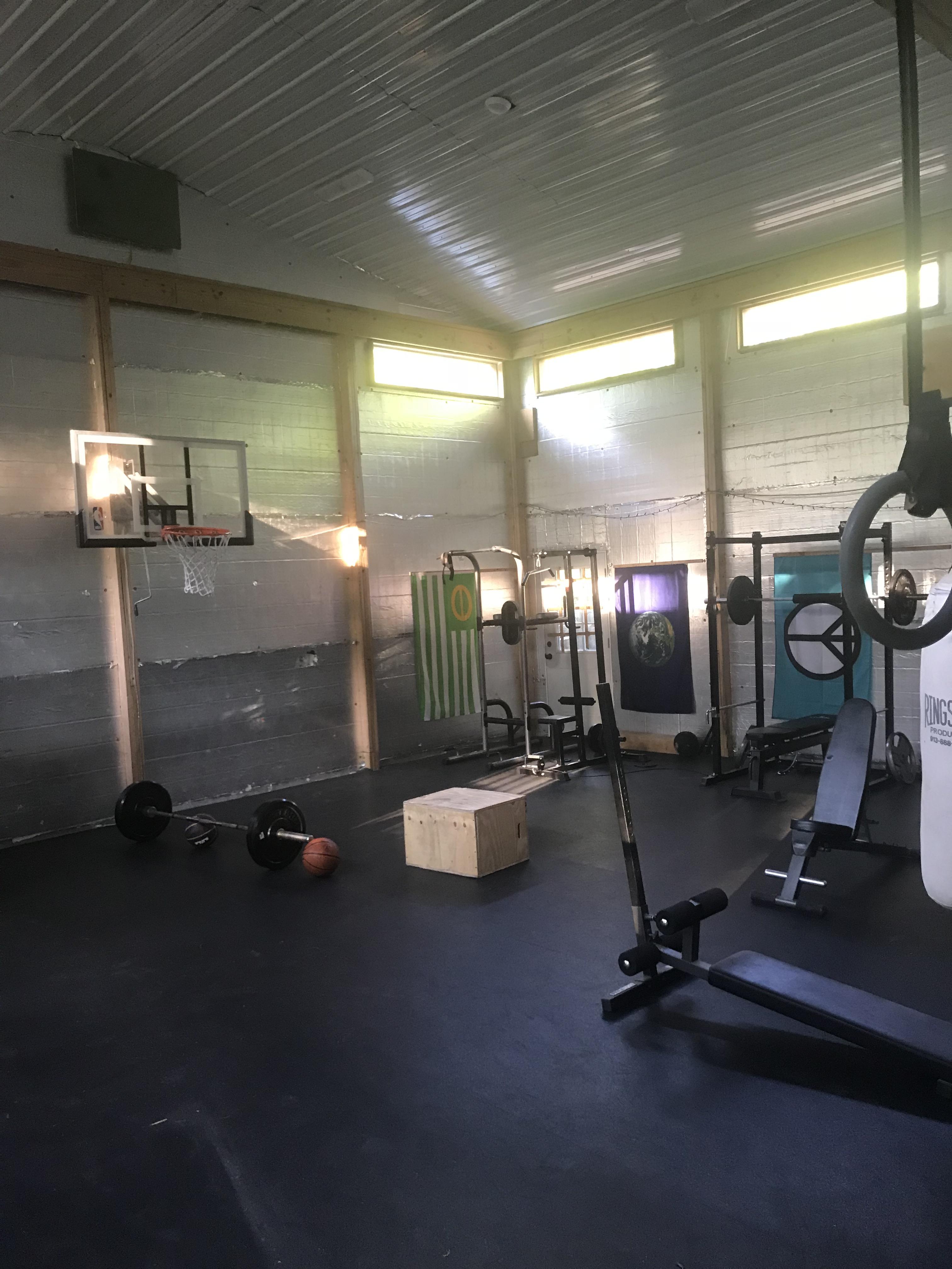 My barn gym/kids play space. It’s the back half of my pole barn garage