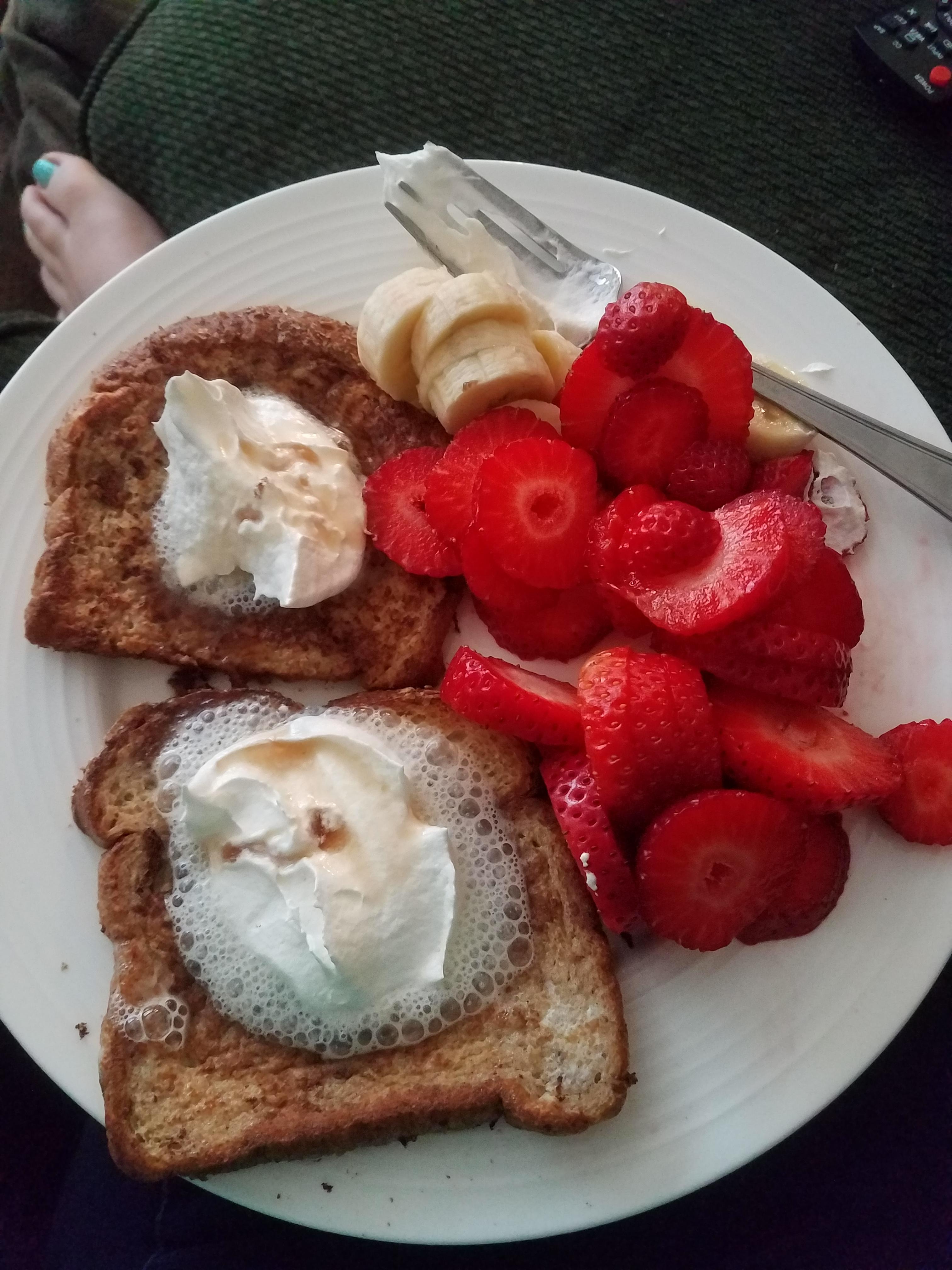 328 calorie French toast with maple syrup, whipped cream, and fresh