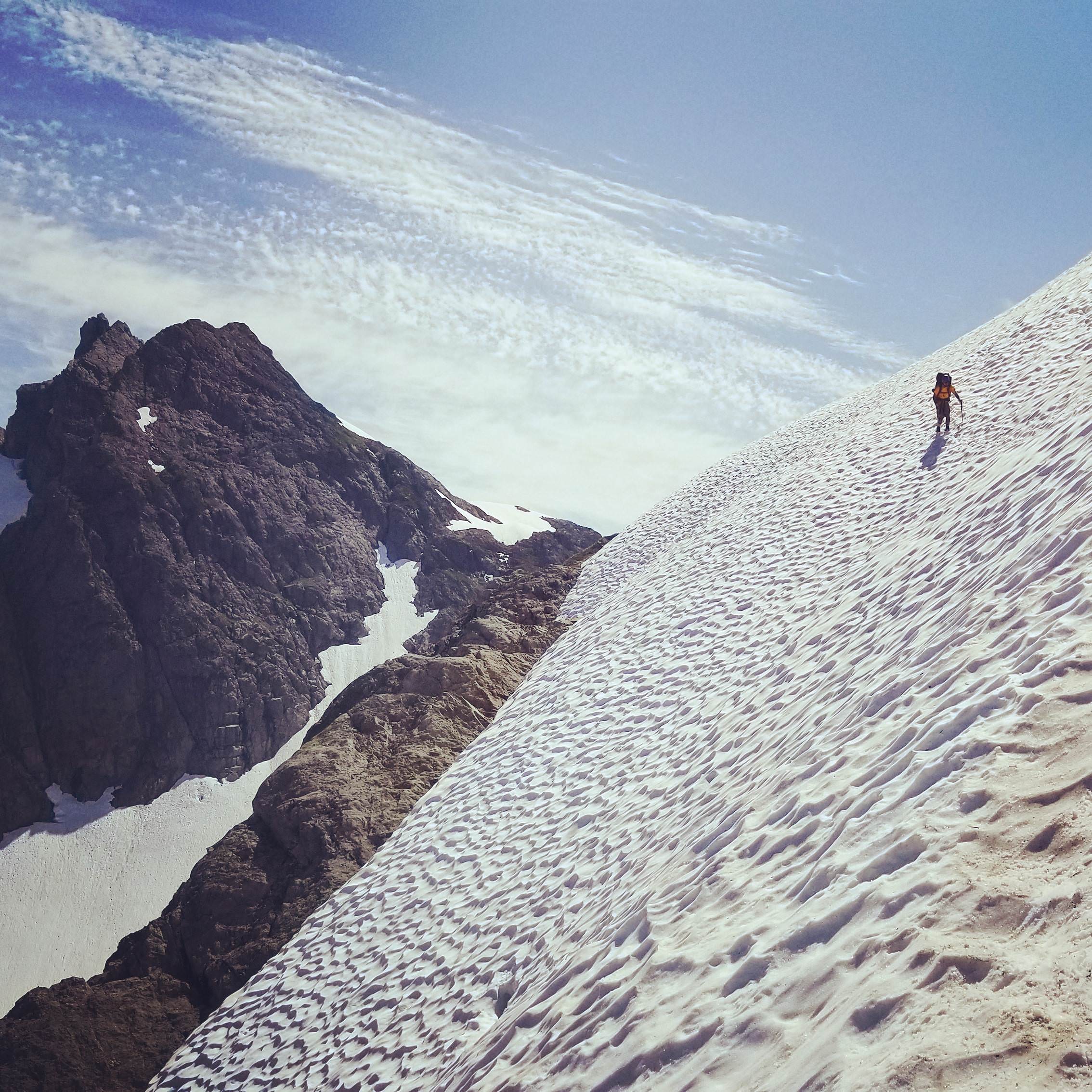 Snowfield traverse descending from Three Fingers Lookout (which is at