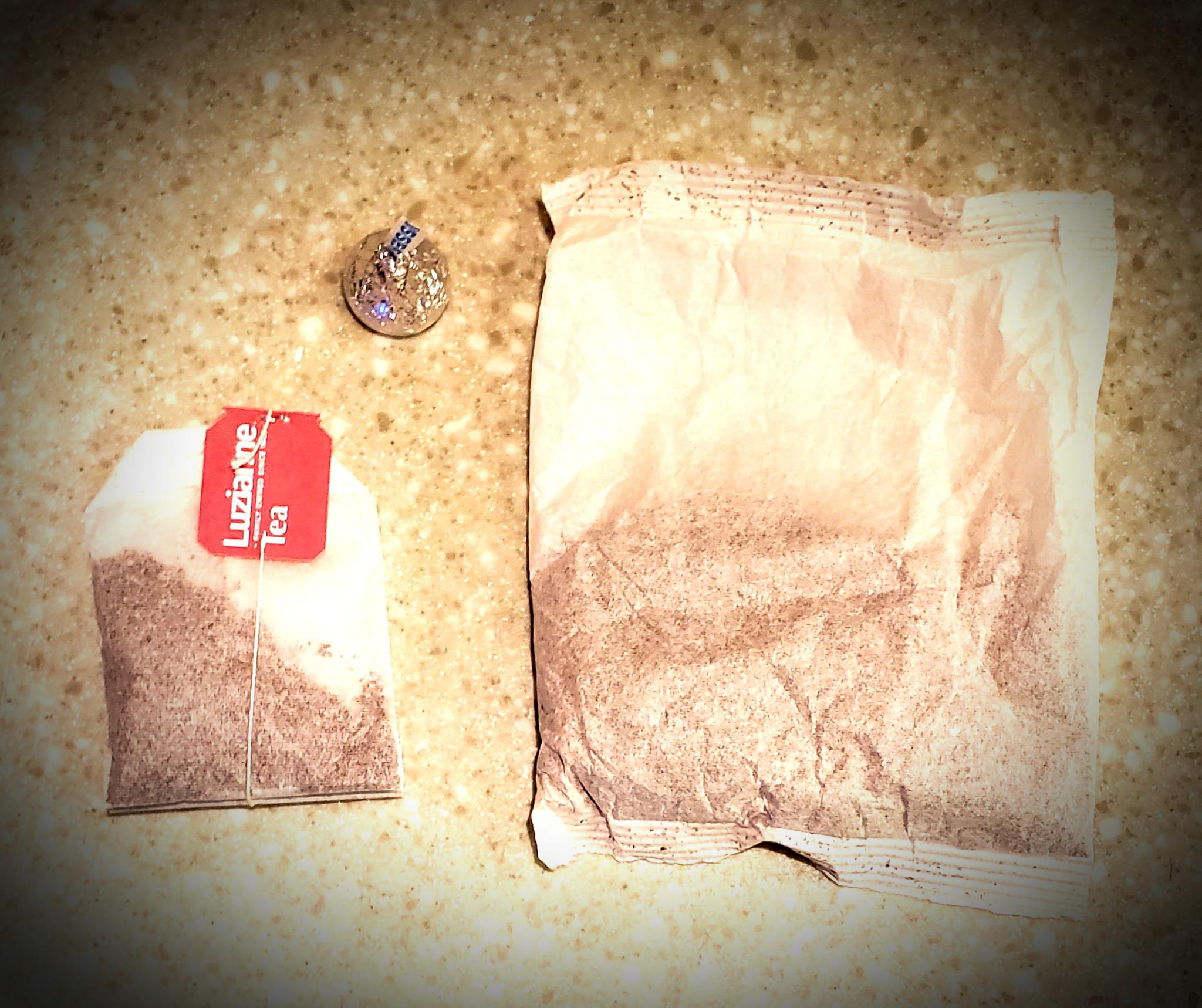 As promised, a Luzianne "familysized" tea bag next to a "gallon pouch" for sweet (black) tea