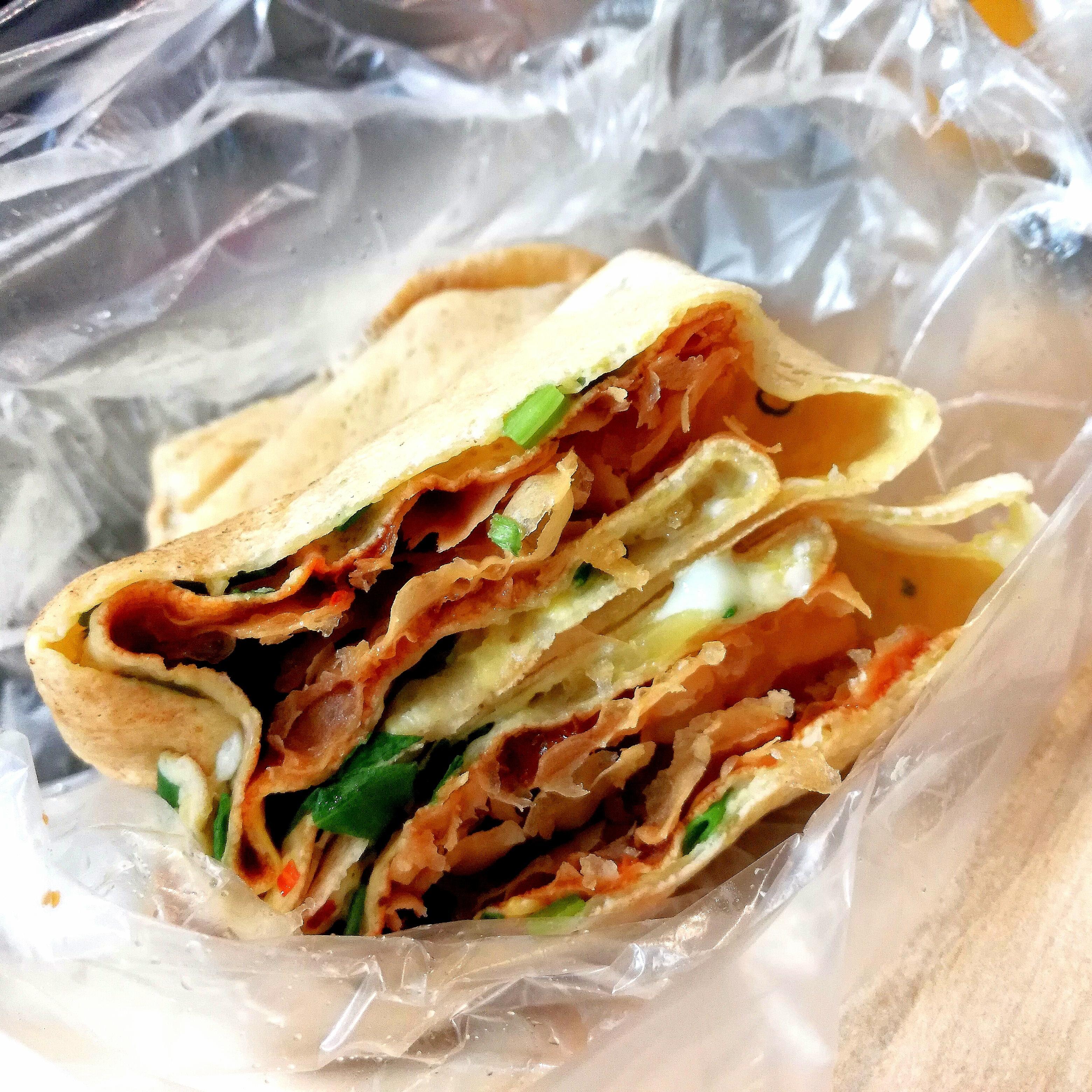 [I ate] Chinese breakfast pancake with an egg, crispy wanton, spicy