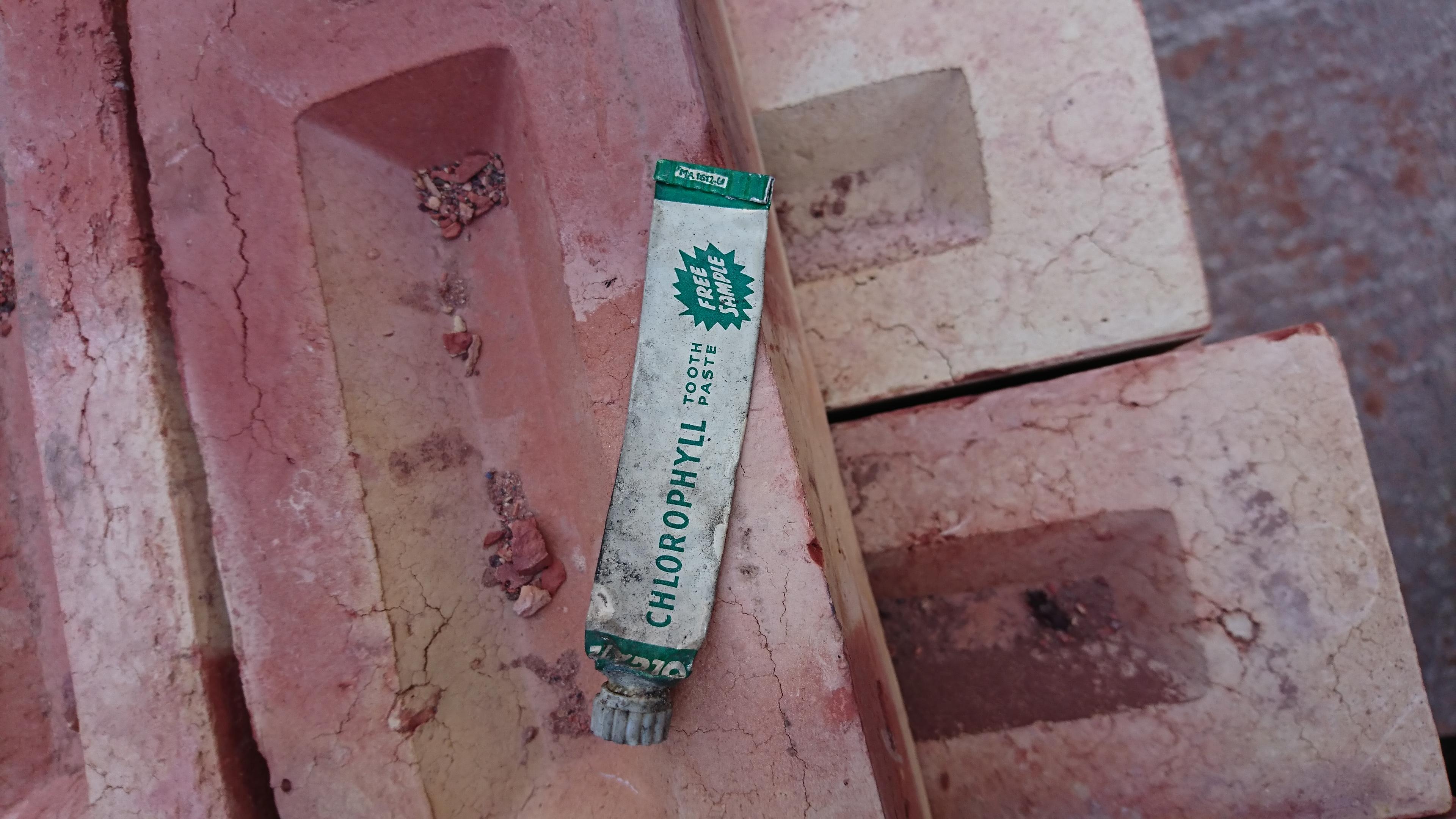 This well used 1950s toothpaste tube that fell out of a wall I was