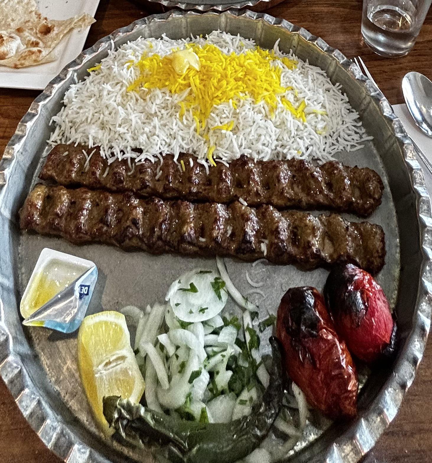 Persian Koobideh Kabob and saffron rice, grilled tomatoes, and onion