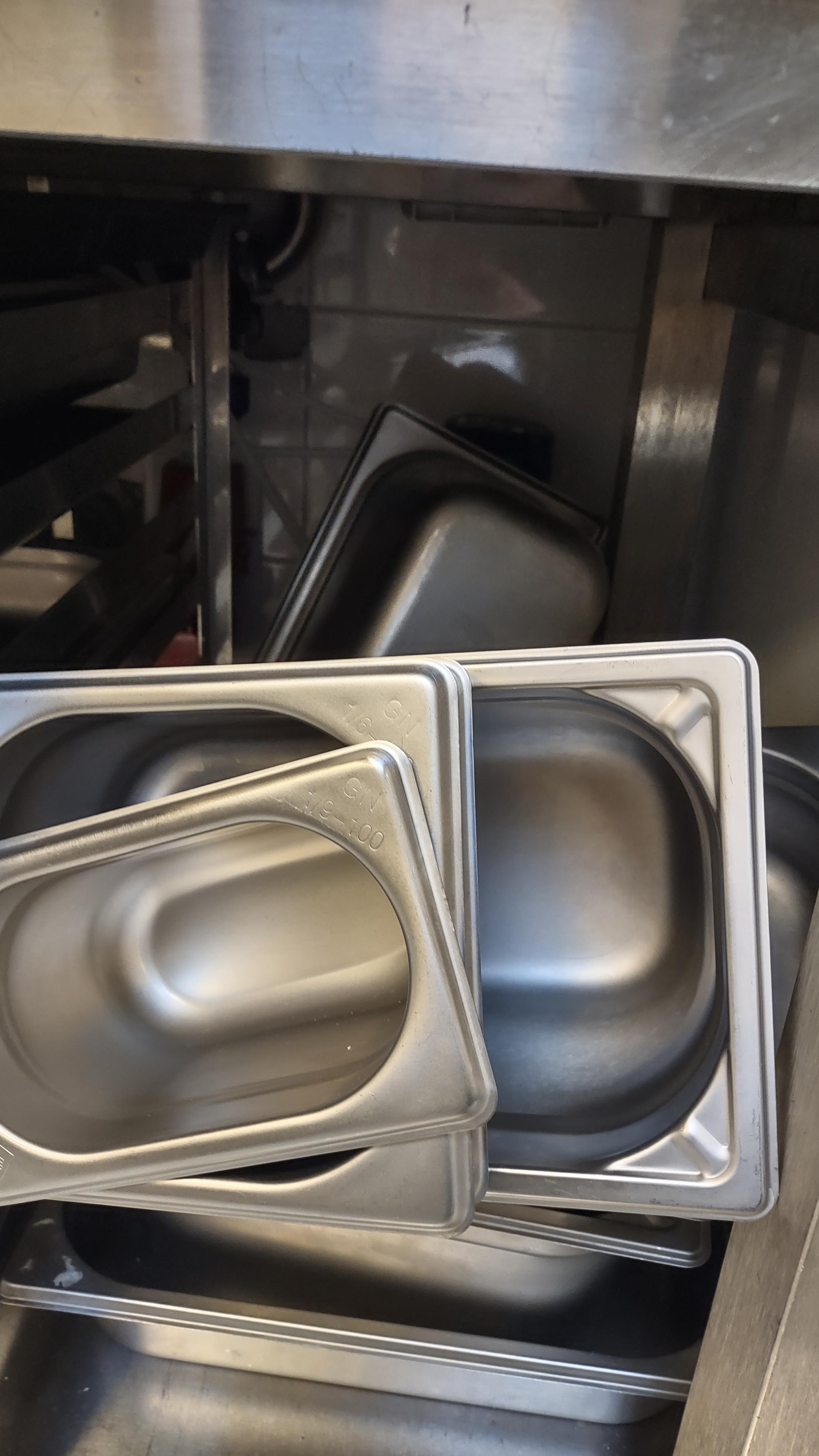 How our dishwashers stack GN trays. r/KitchenConfidential