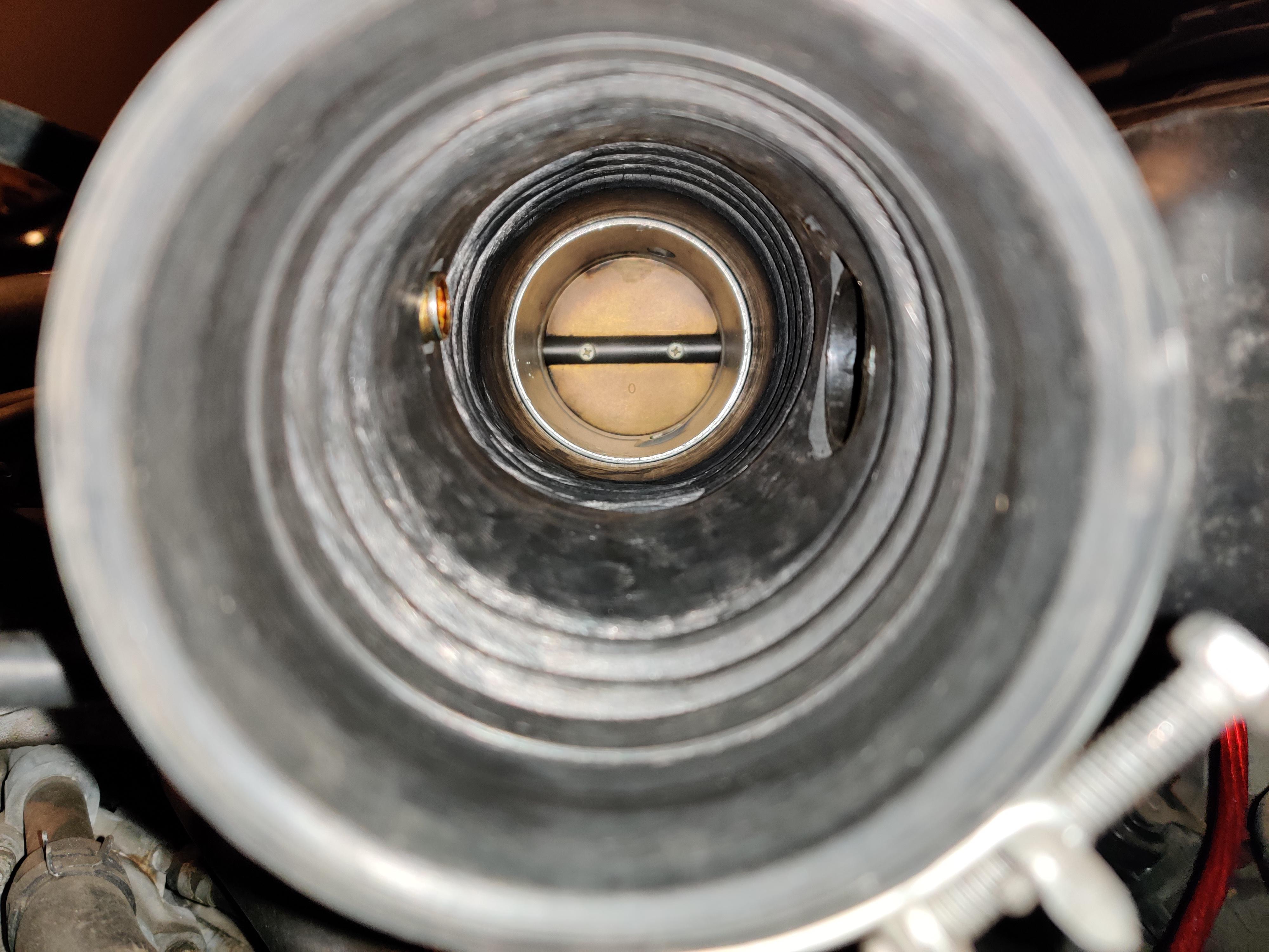 Throttle body smells strongly like gas and looks like this 200 miles