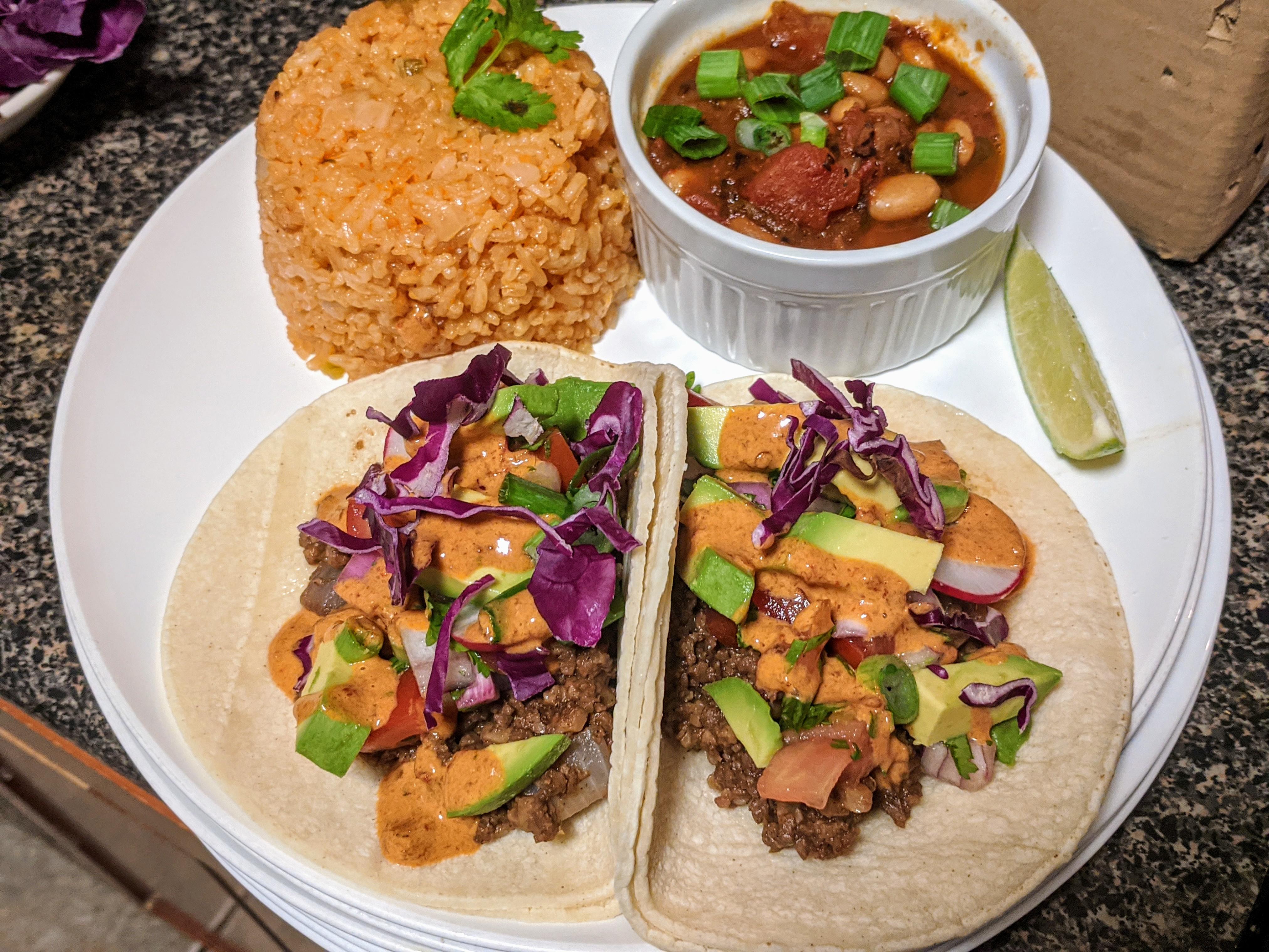 Tacos with Spanish rice and adobo pinto beans r/VeganFoodPorn