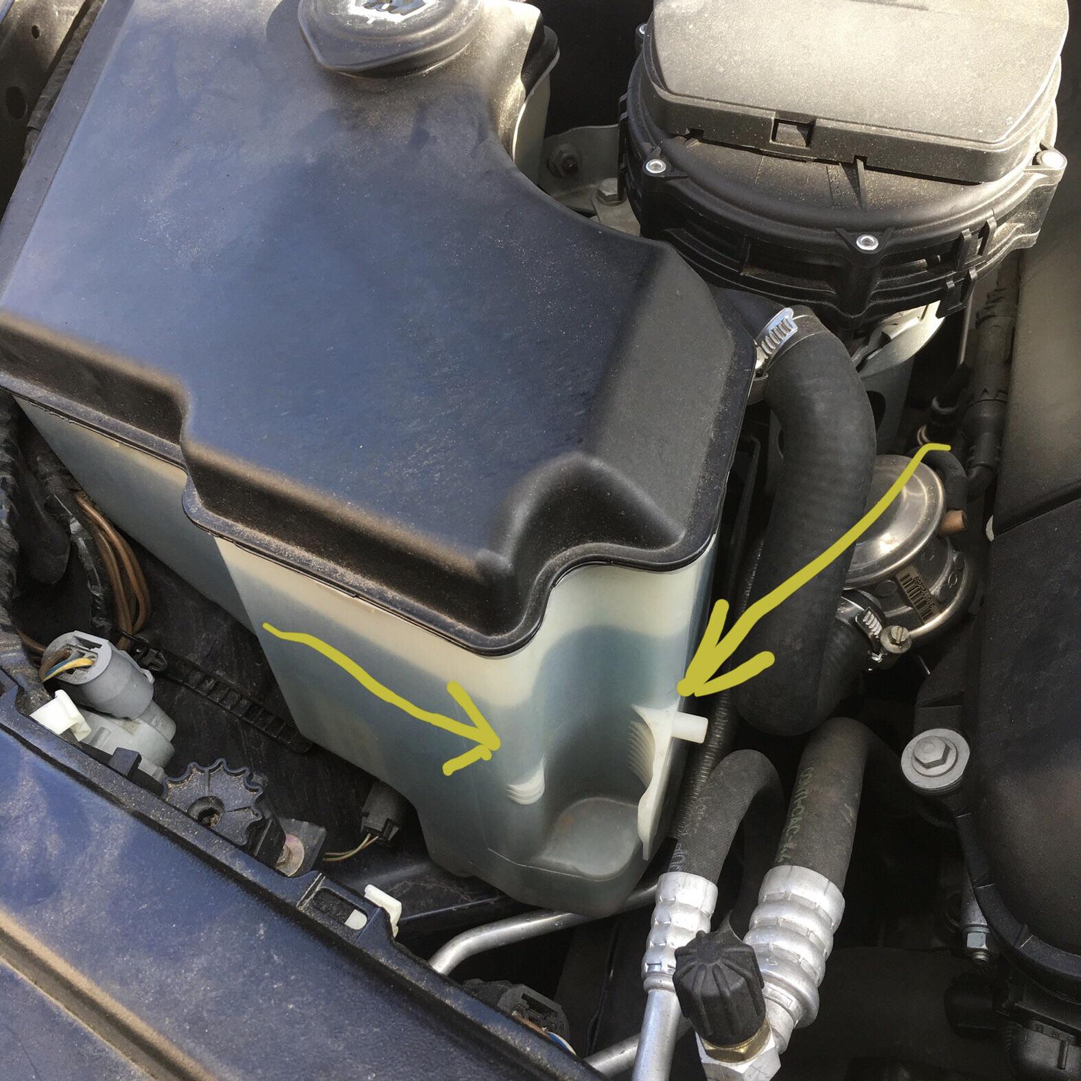 What snaps into this cavity molded into the windshield washer fluid
