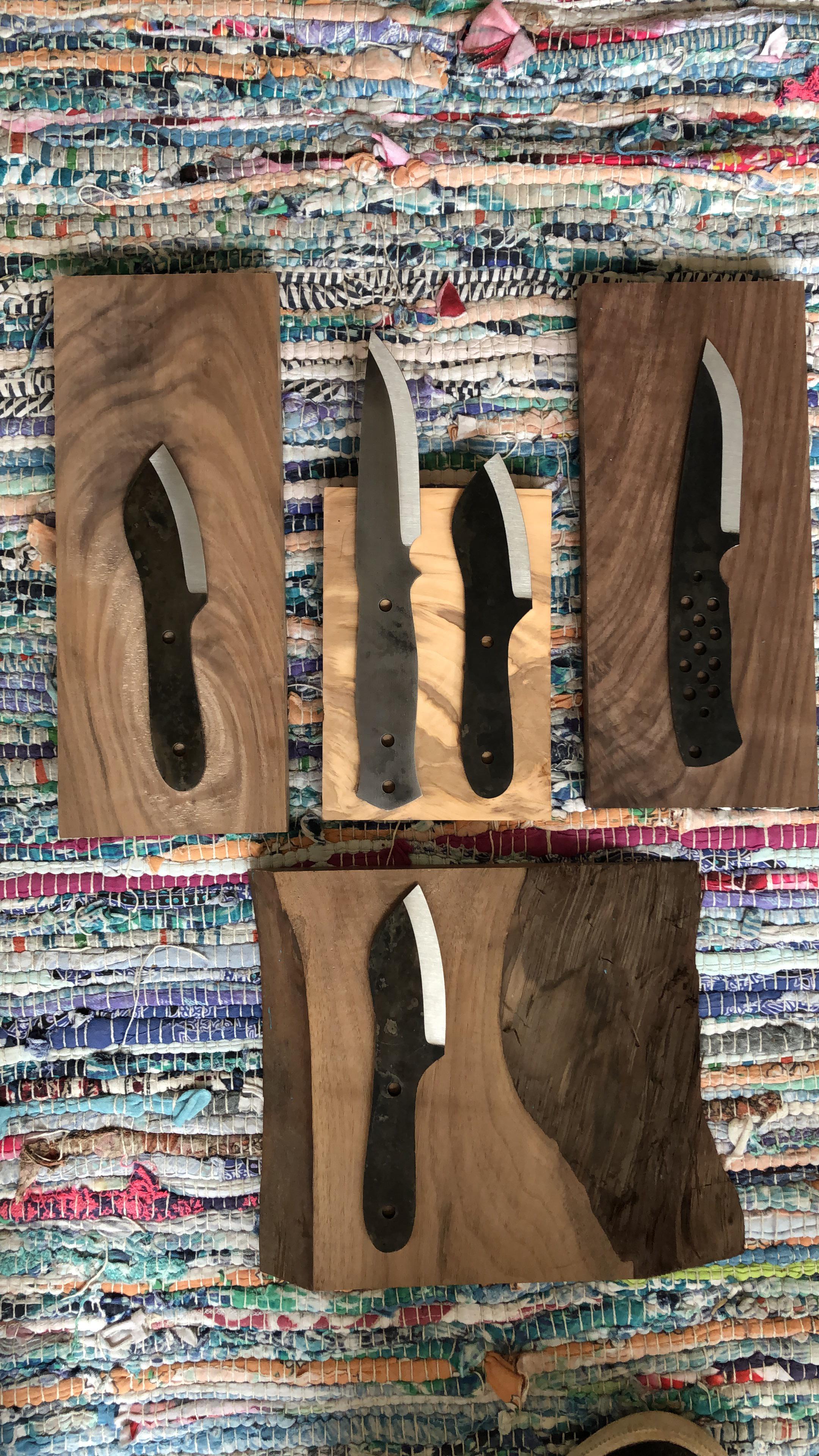 My first attempt at making scales. Walnut and olive wood and blades