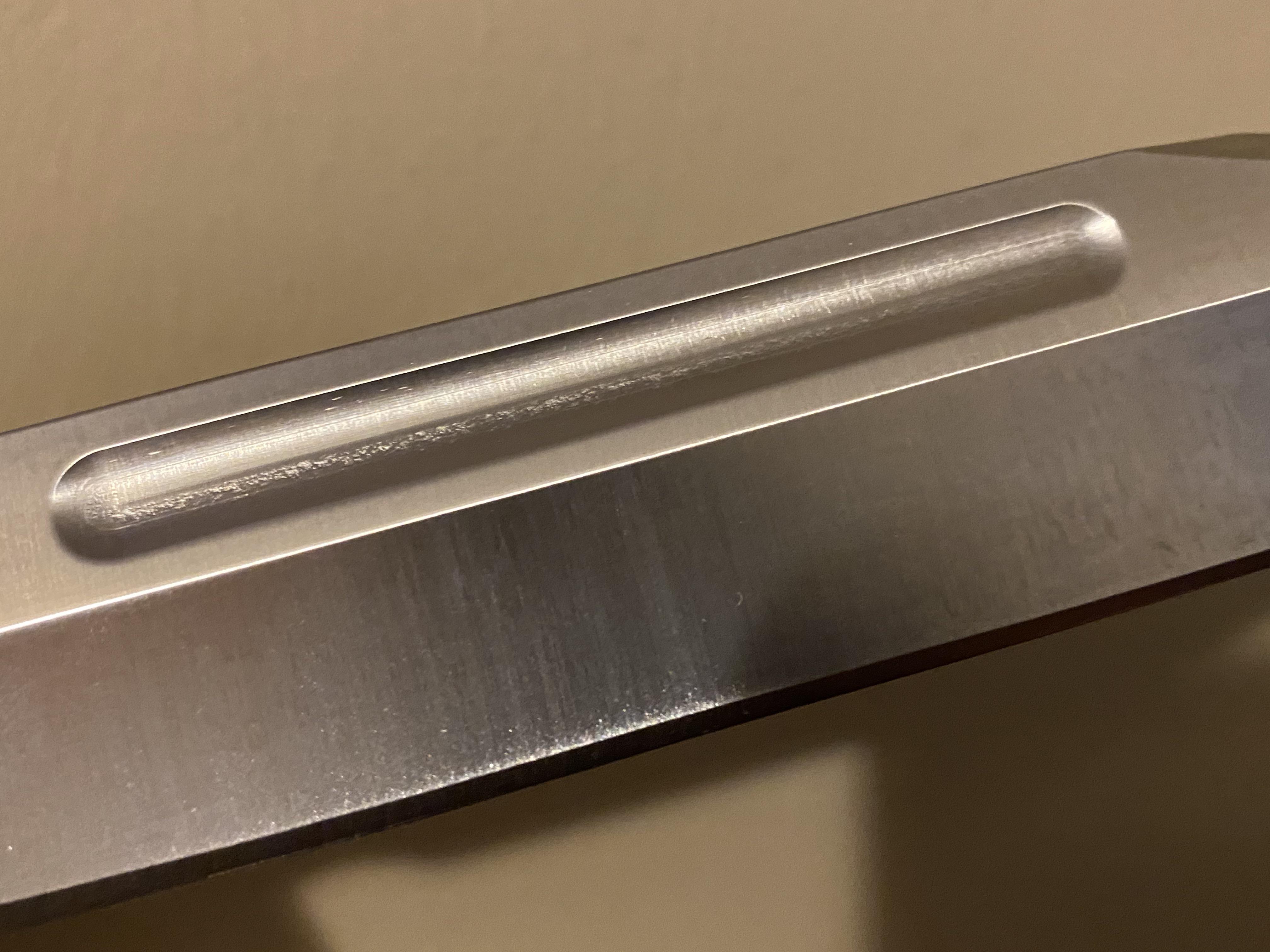 What is this in the blood groove on my Buck 120? r/knives