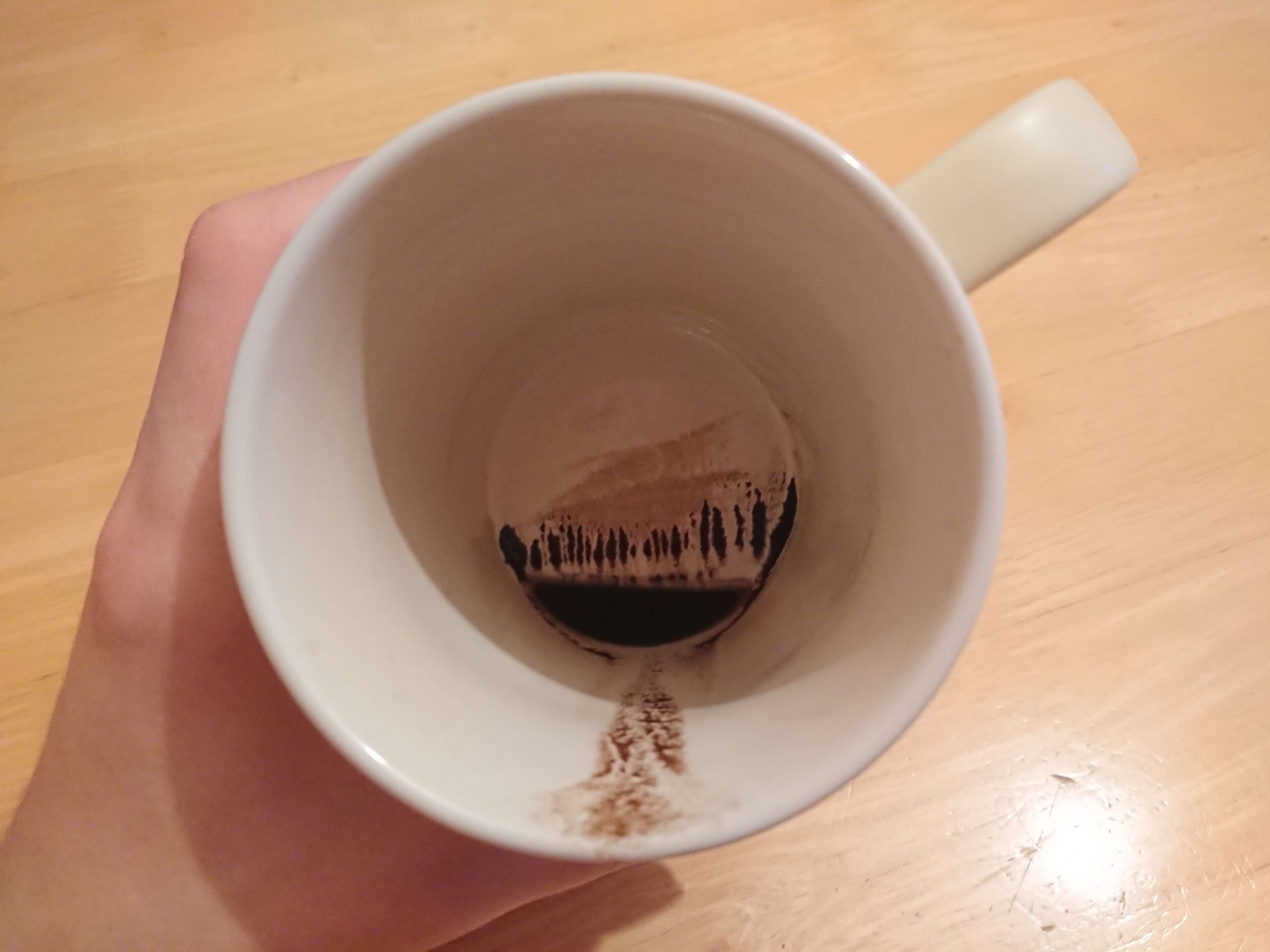 Coffee residue in my cup looks like a landscape painting r