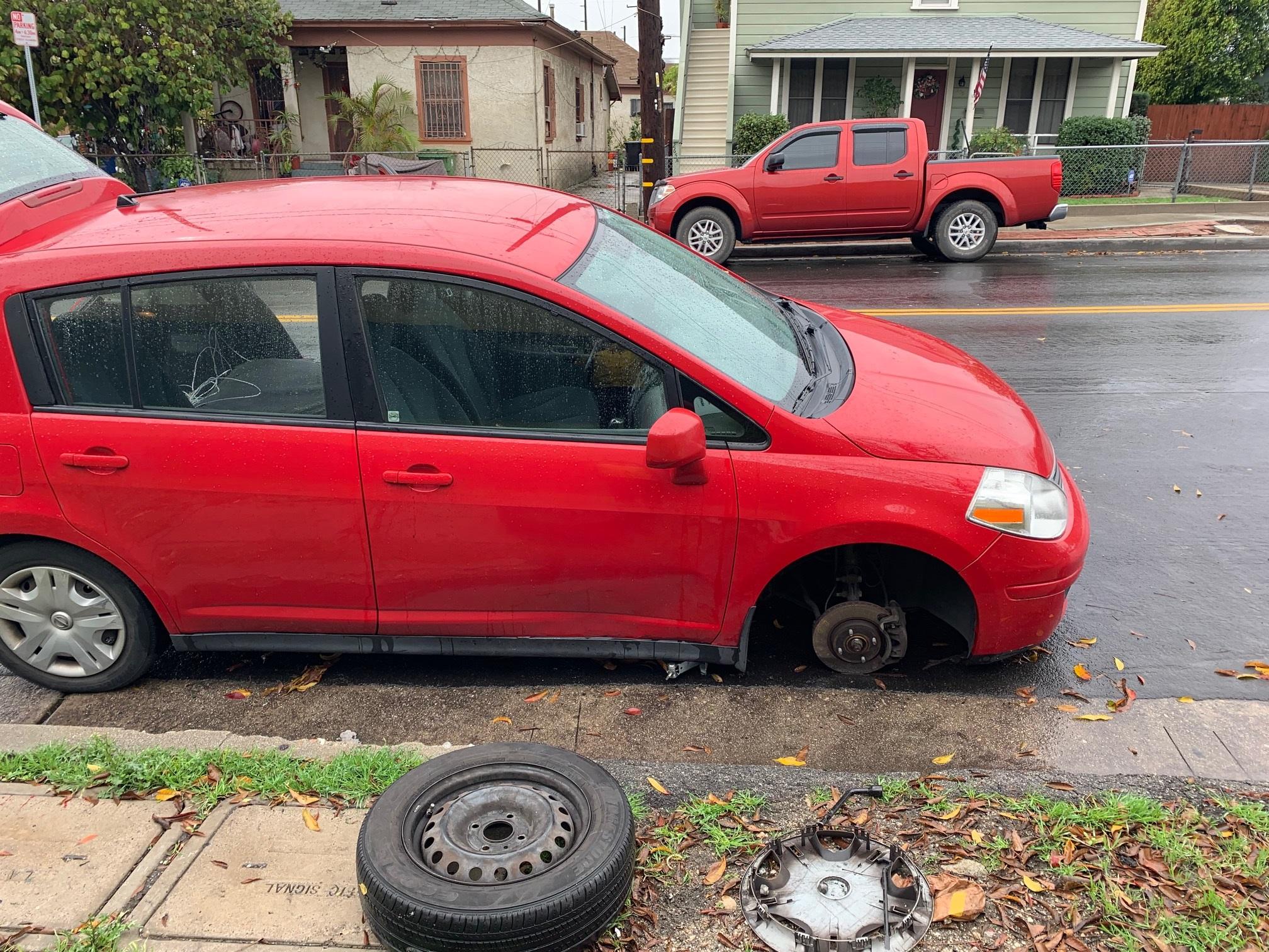 Car fell off the jack when fixing a flat tire. In the rain. On the way