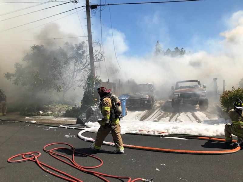 A fire in Pleasant Hill has left two houses burned down and a firefighter with minor burns r