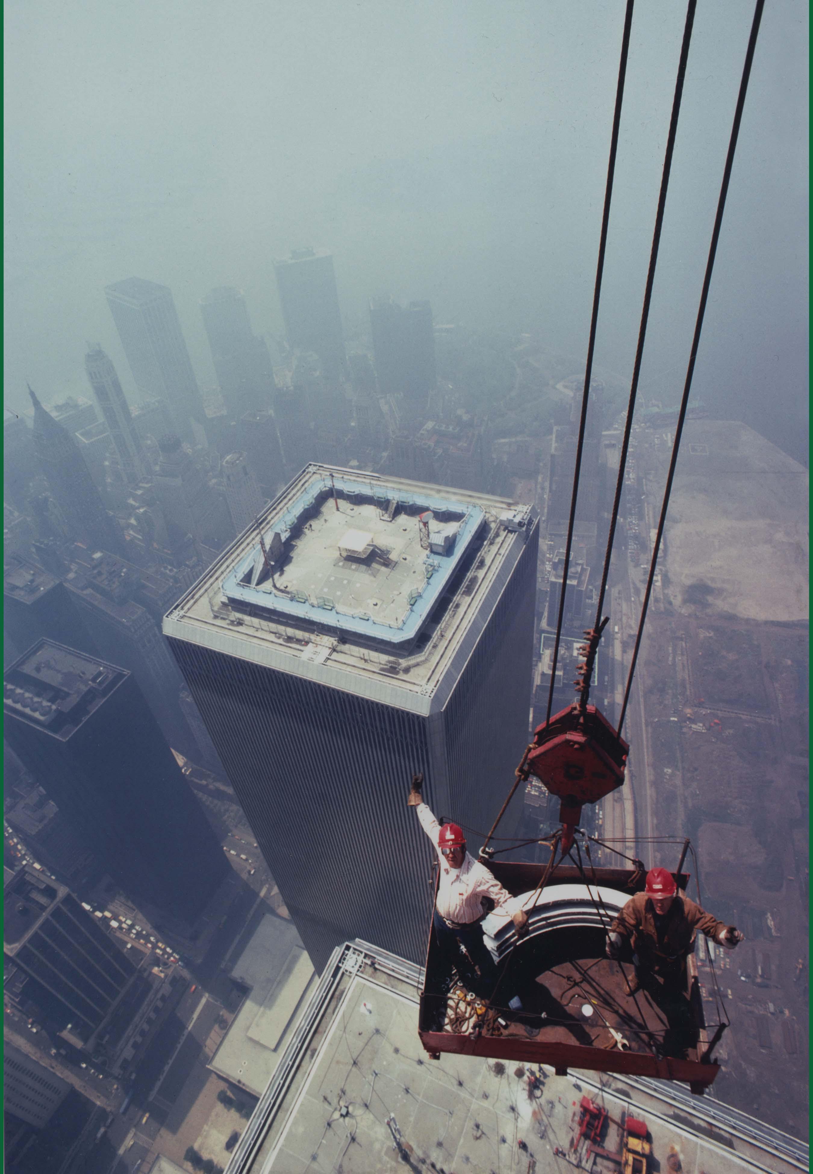 Iron Workers pose for a photo atop the North Tower of the World Trade