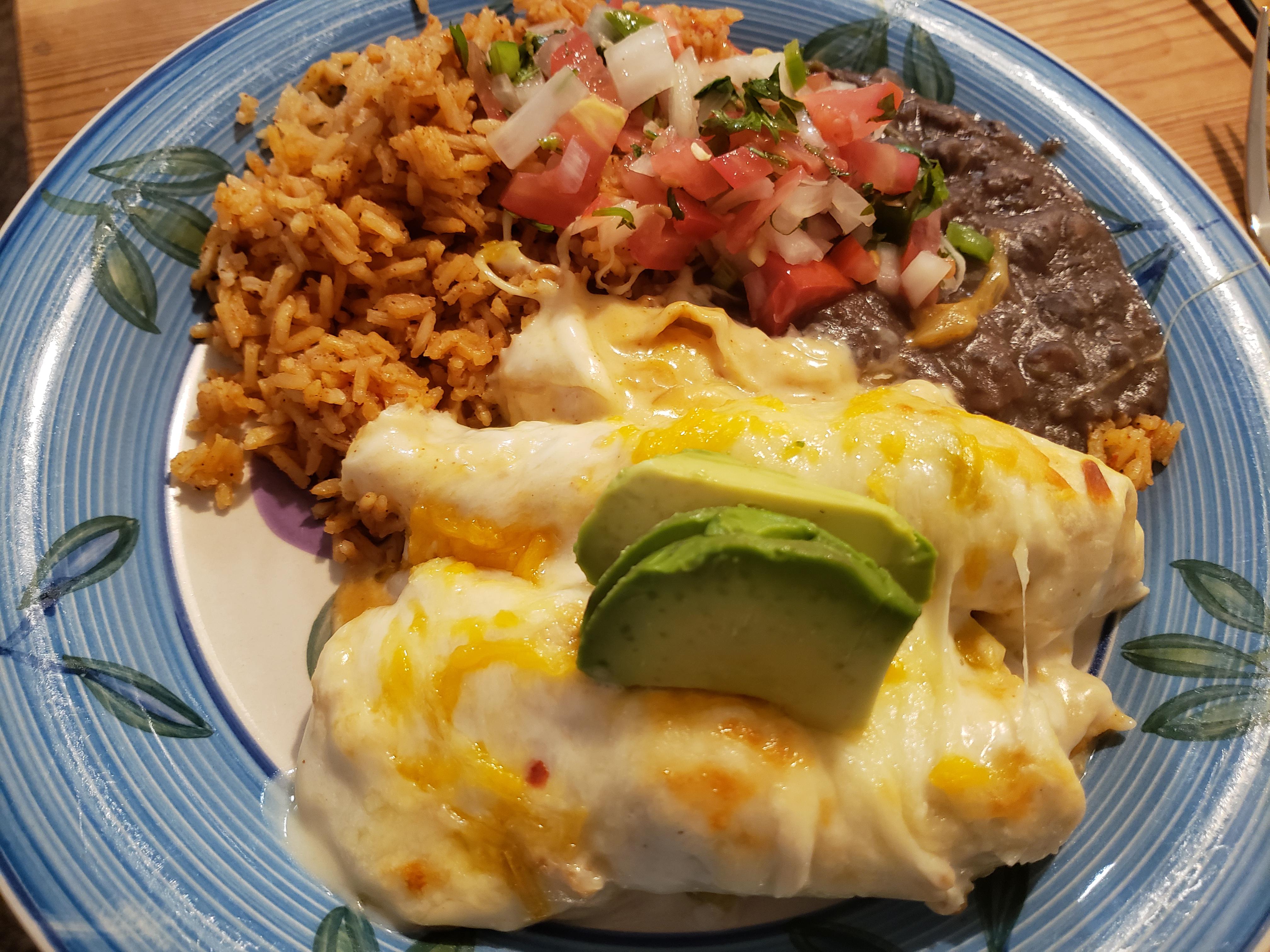 [Homemade] Sour cream chicken enchiladas, rice and beans r/food