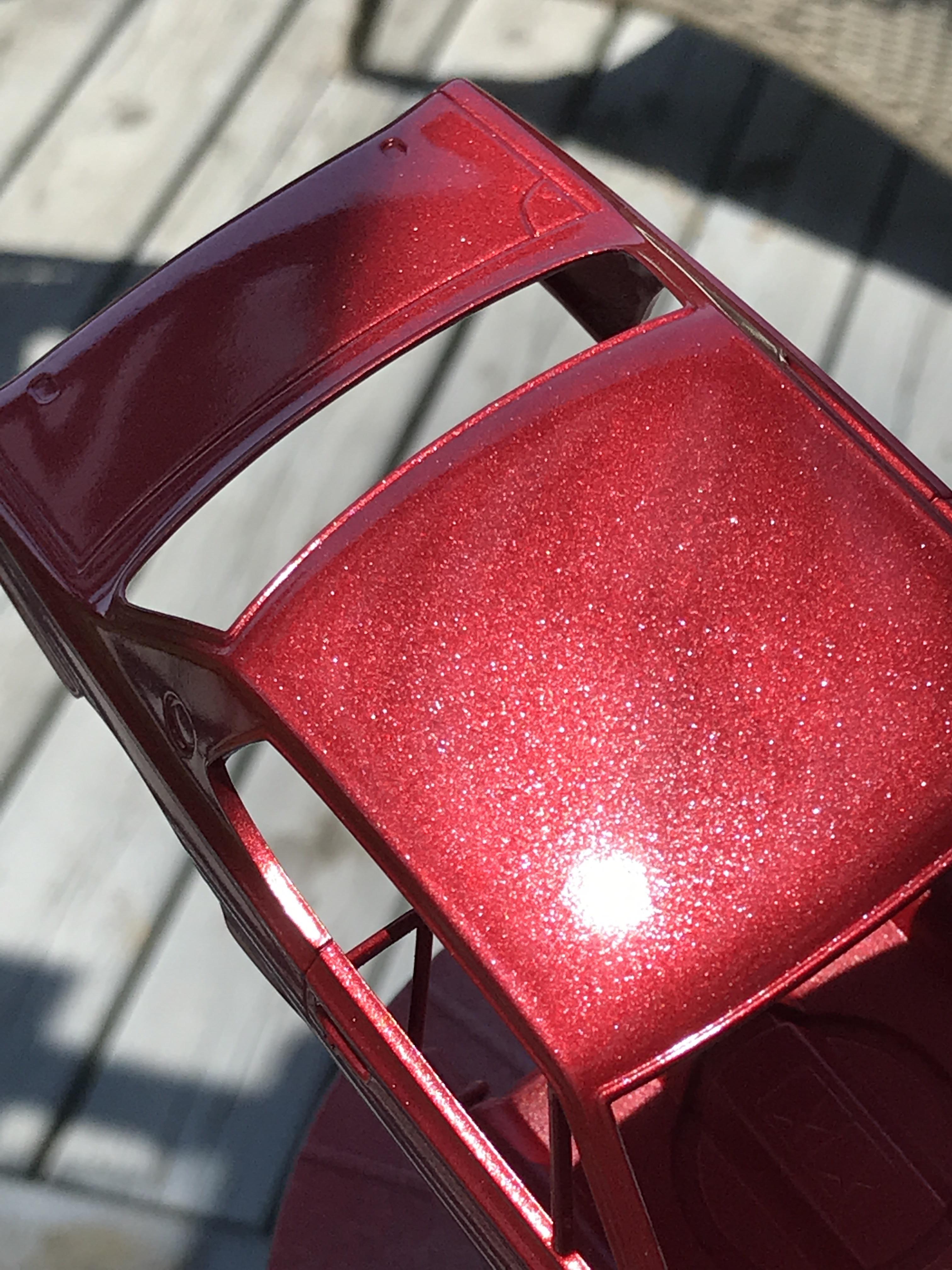 Photo does not do this justice. Silver base, 4 coats metallic red, wet