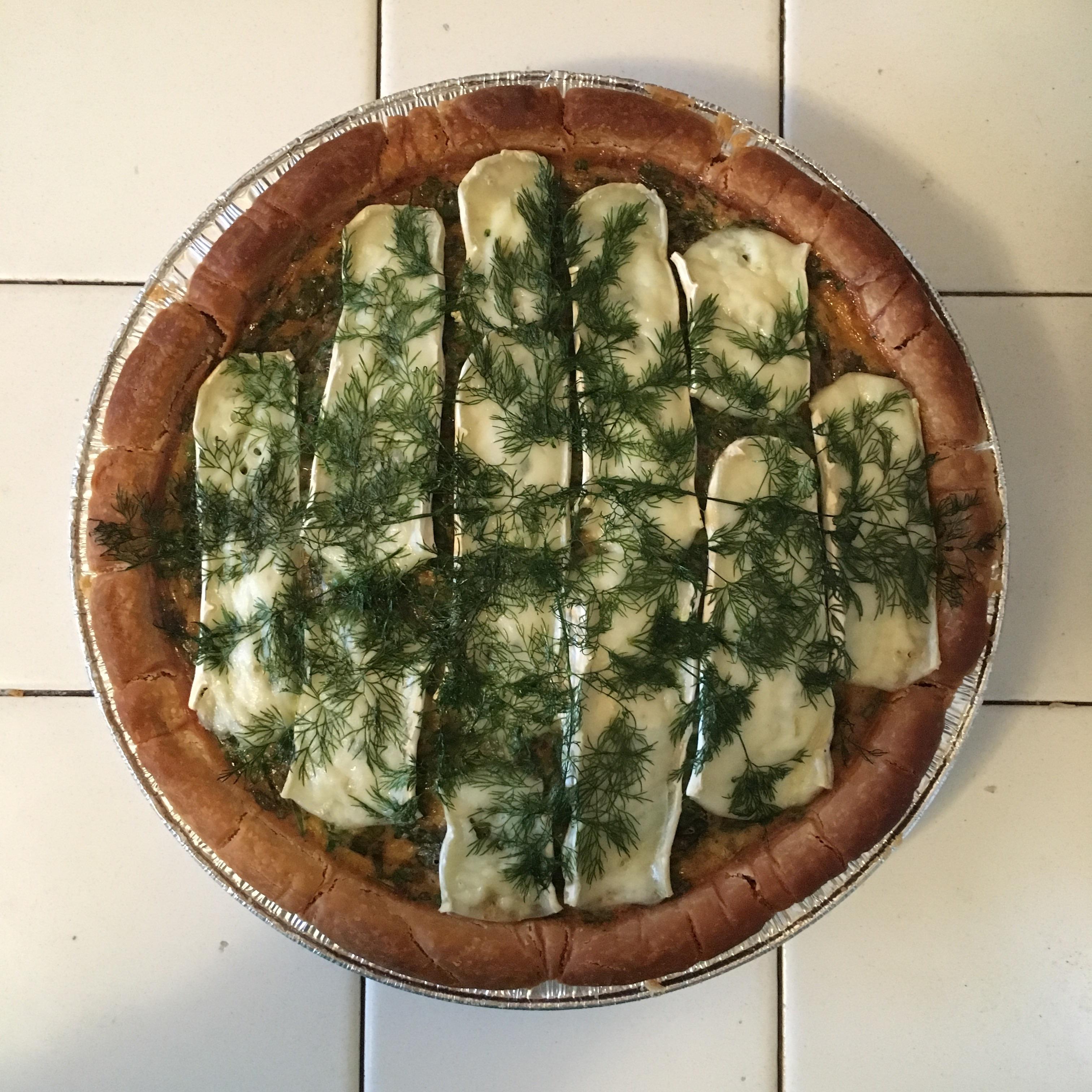 Not the best lighting, but I made a dill, brie, pea, and roasted garlic quiche for the week