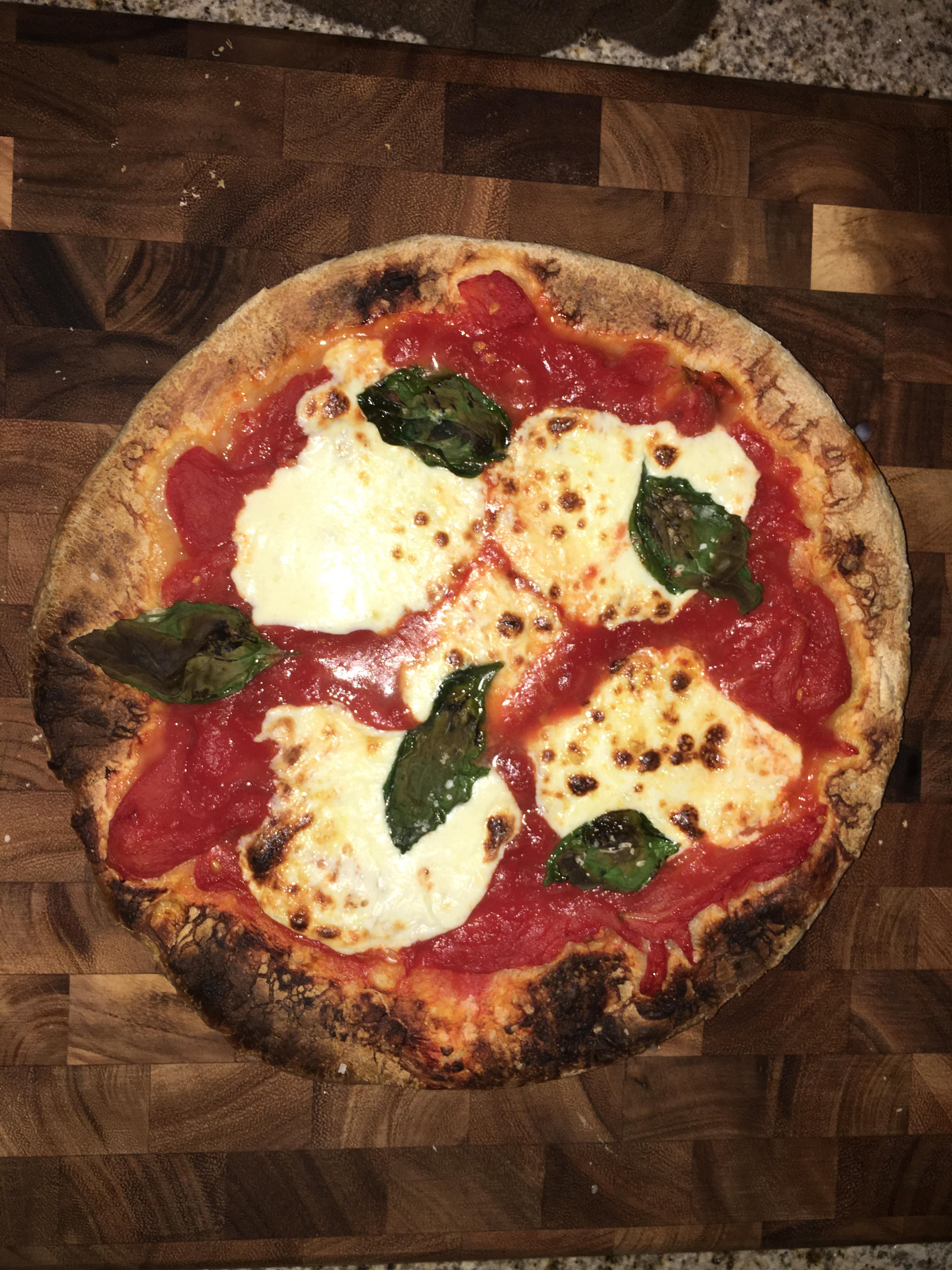 Whole peeled San Marzano tomatoes, fresh mozzarella and fresh basil in