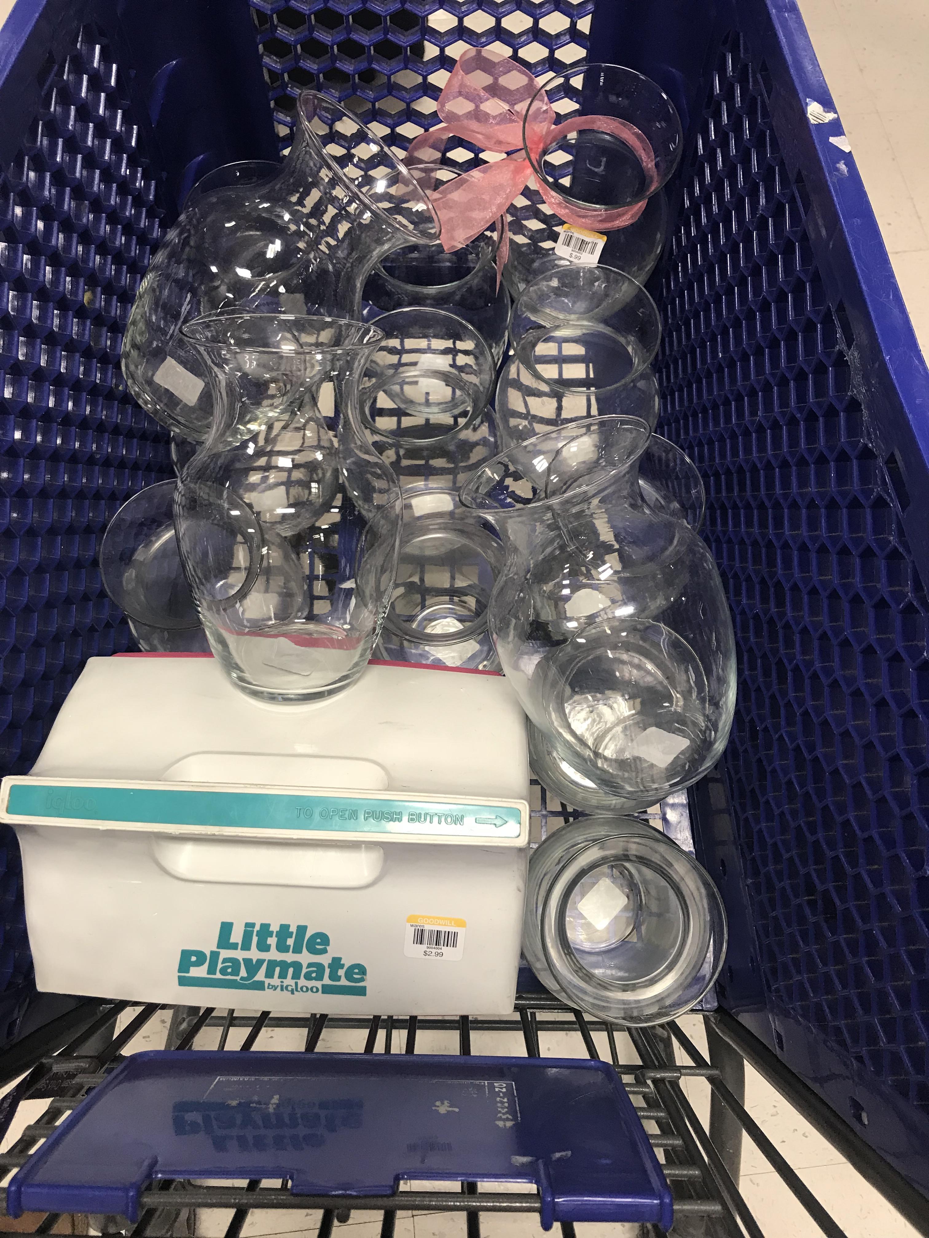 I found 14 matching glass vases for less than 20 at Goodwill! r