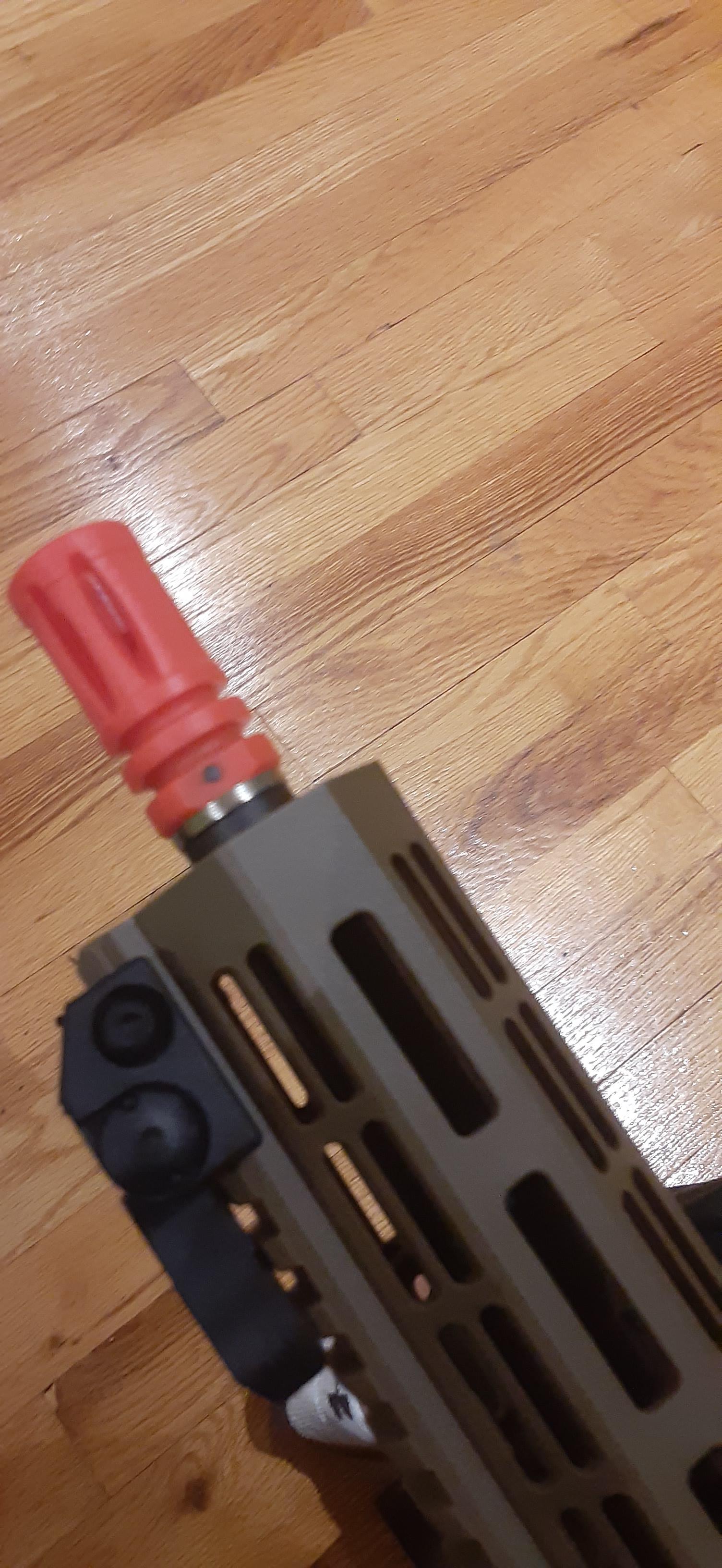 How do I remove the orange tip on an Elite Force CQB M4? This appears to be the only screw on it