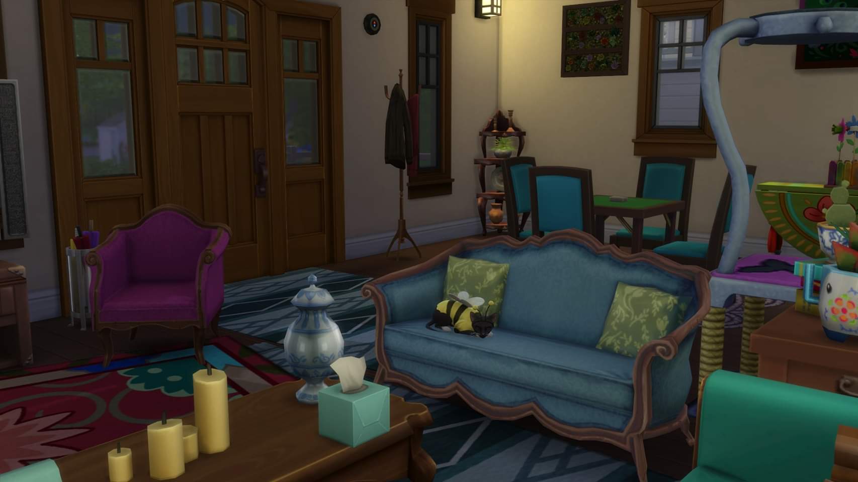 I spent all weekend decorating my Sim household, and got them a cat and