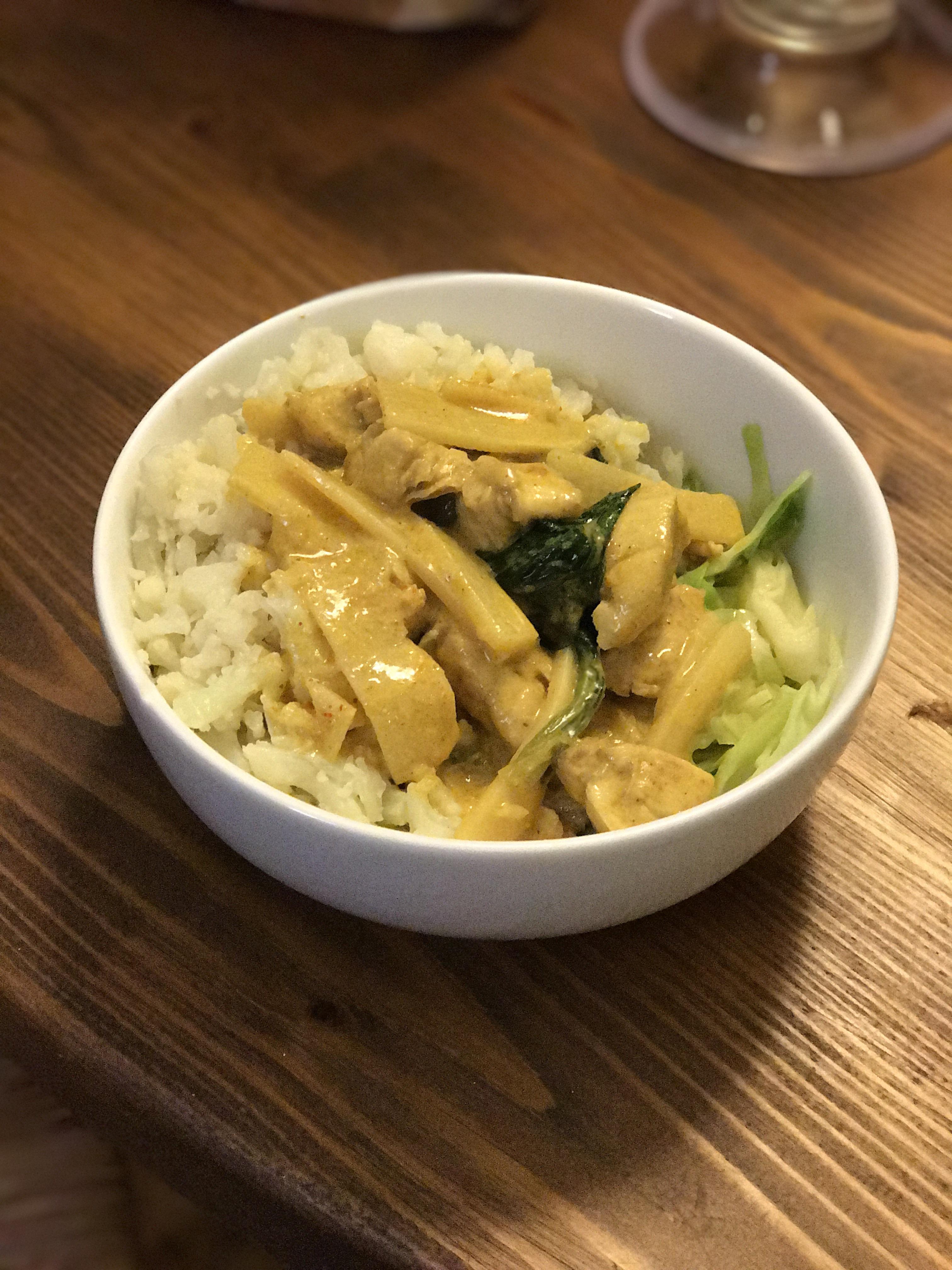 Chicken and bamboo shoots curry over cabbage and riced cauliflower