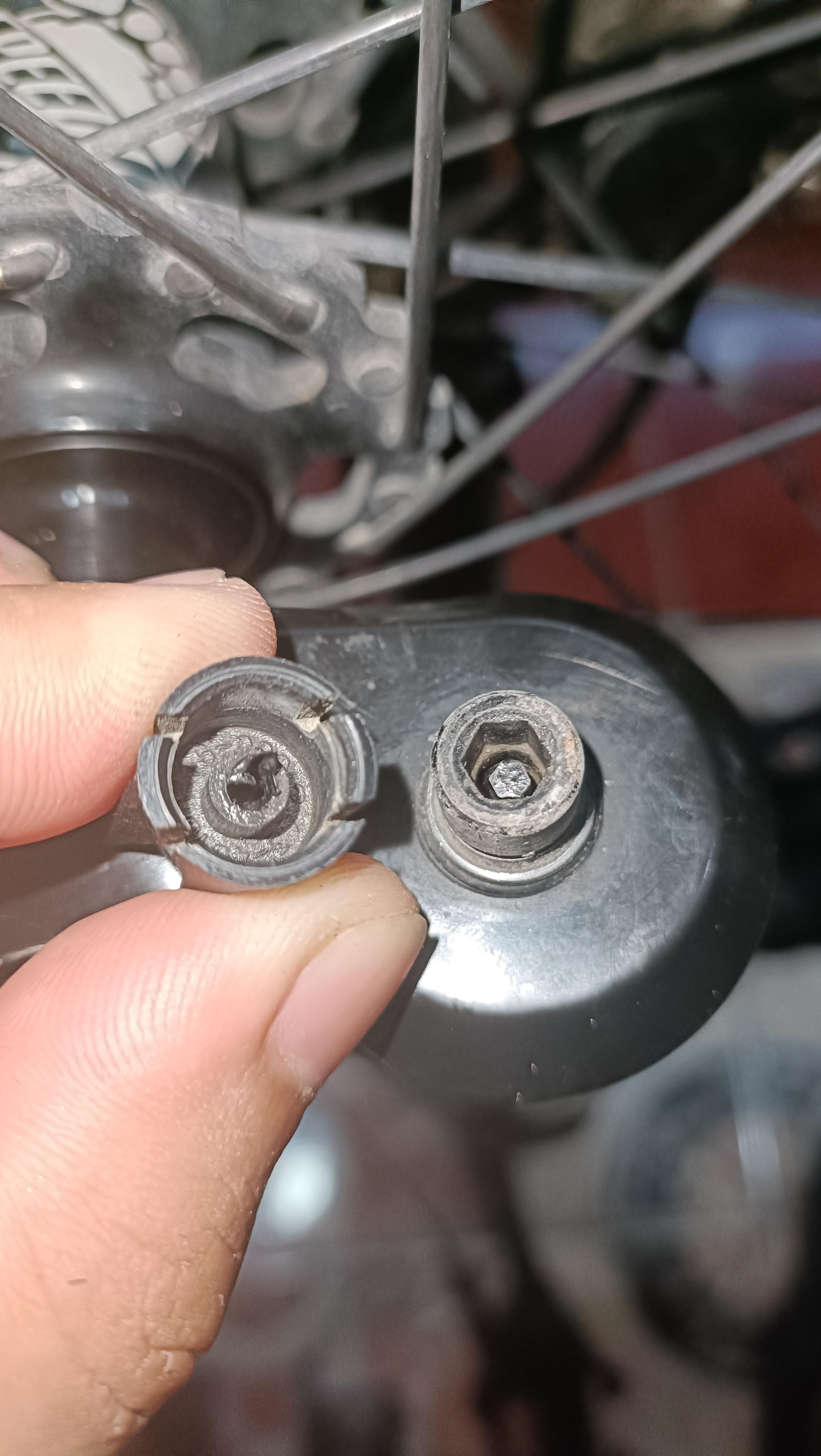 Roundedout Adjustment Knob/Stuck Rebound Key. Any Ideas how to remove