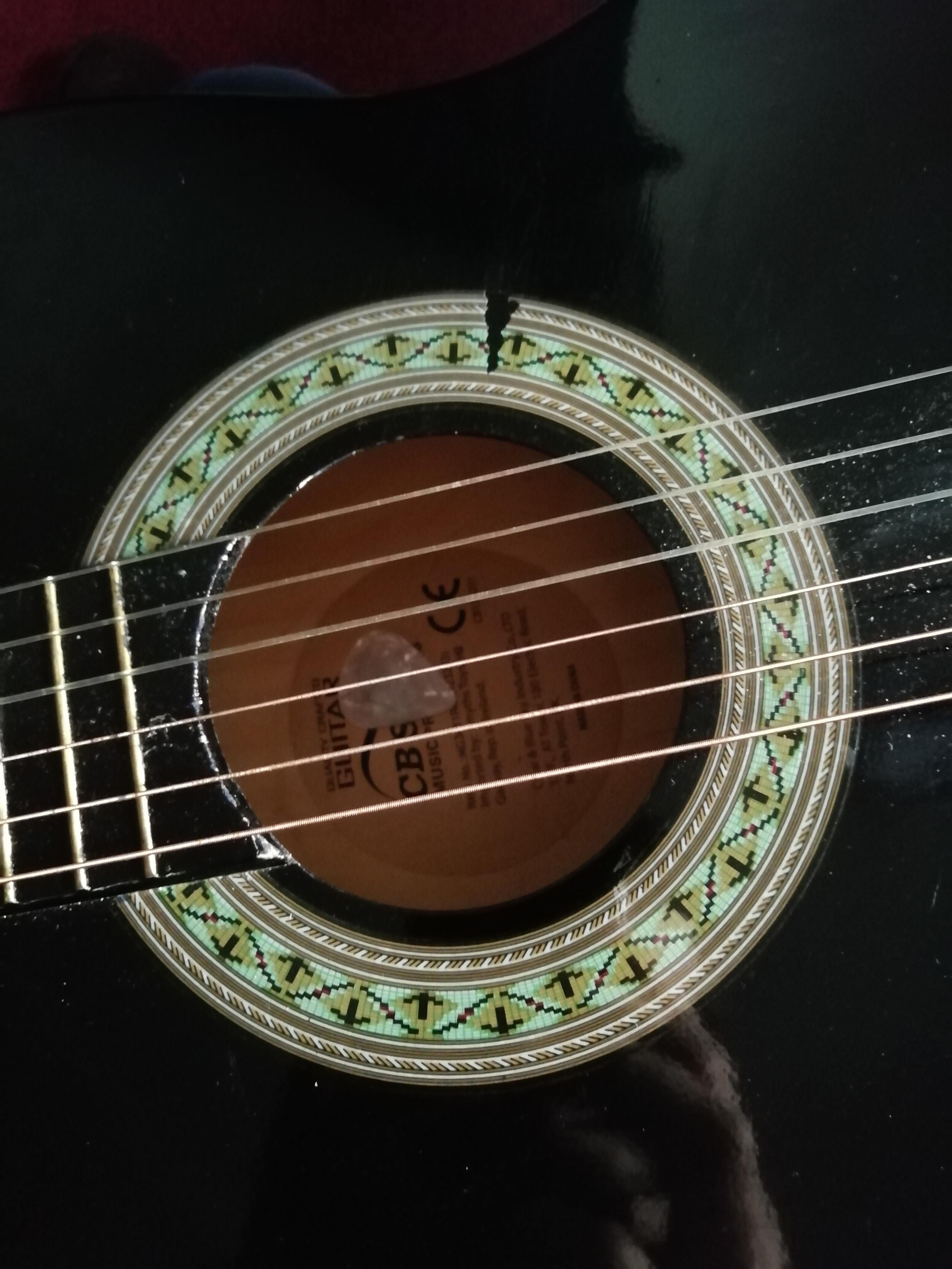 My guitar pick I was using to play my guitar fell in to the guitar as I