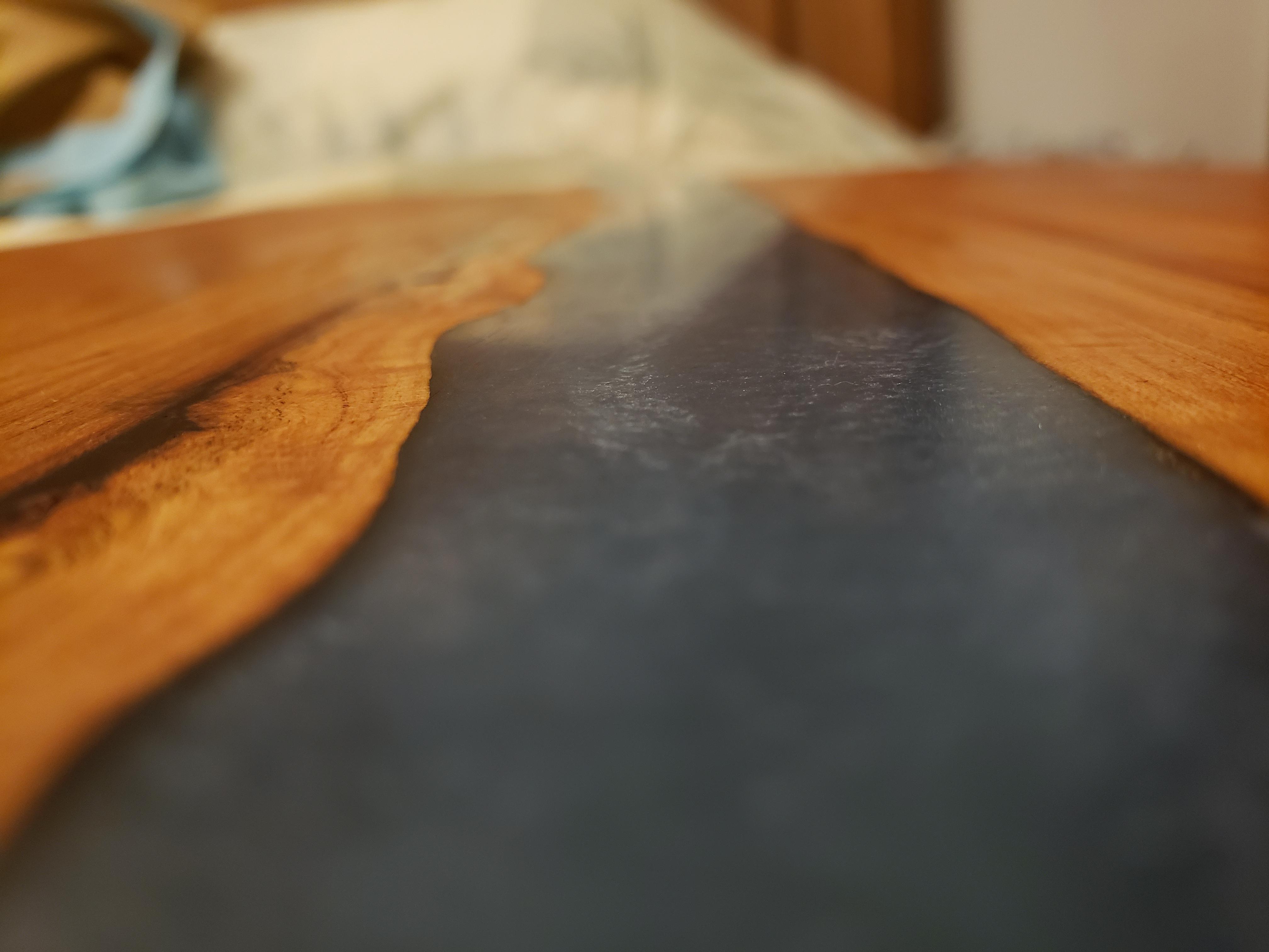 My first epoxy cutting board came out nice, cherry wood and blue epoxy