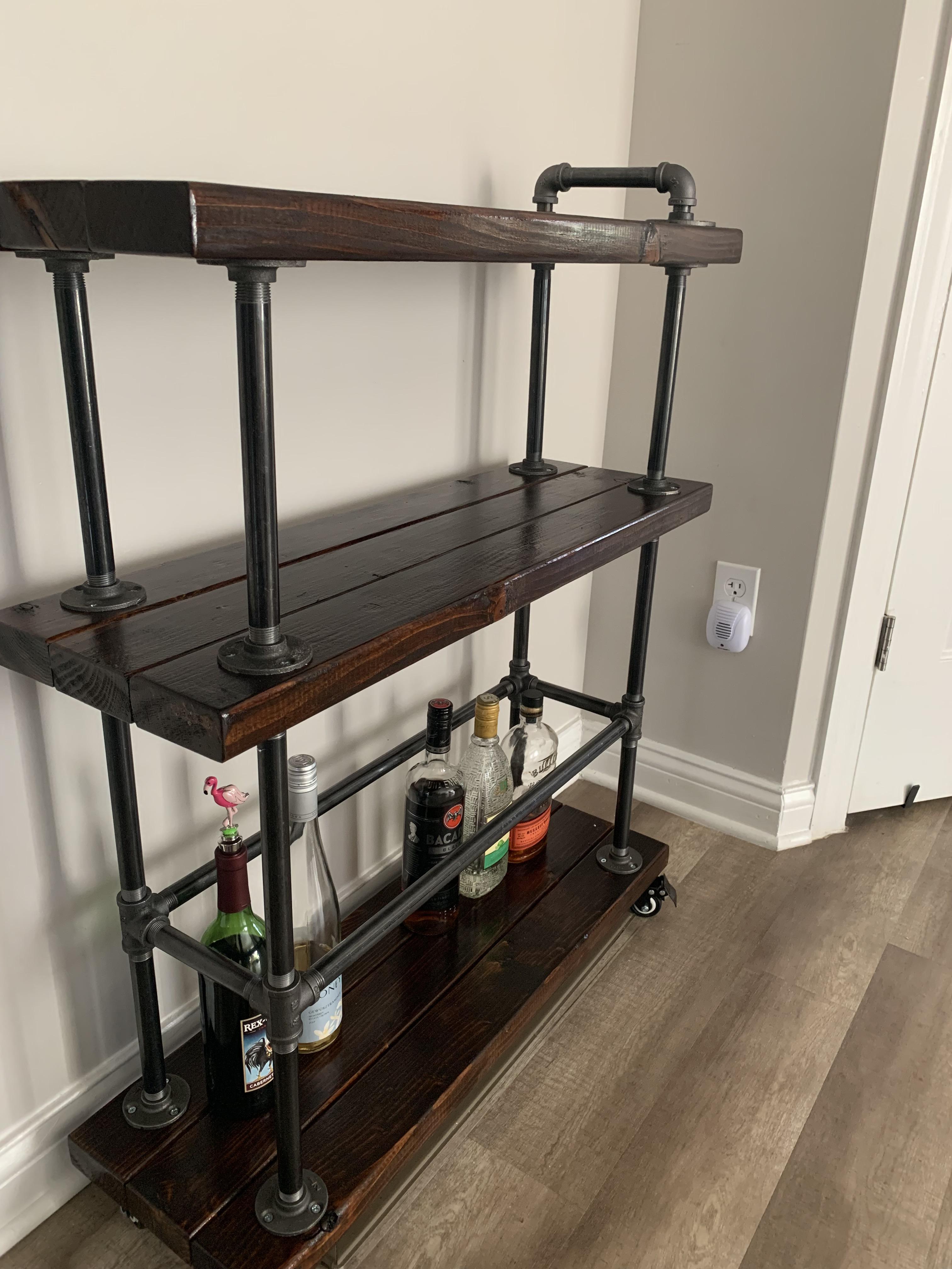 Industrial style bar cart I just finished. It’s the first