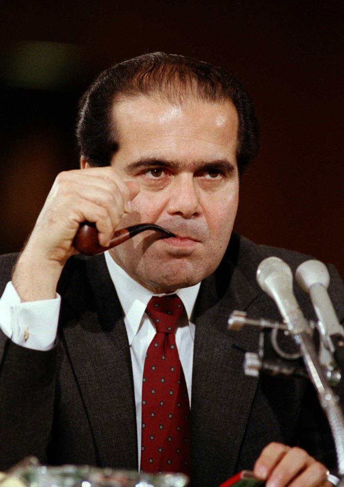Antonin Scalia smoking a pipe during his Supreme Court confirmation