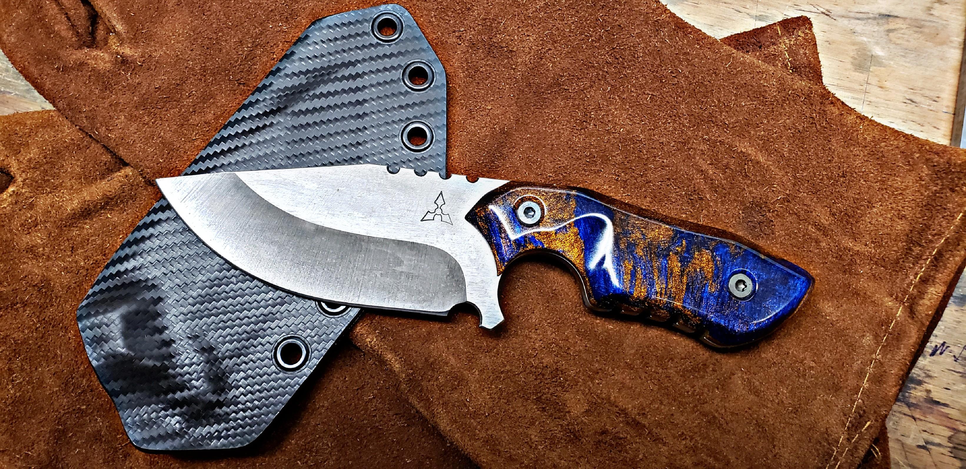 The Falcon with some resin mixed scales. r/knives